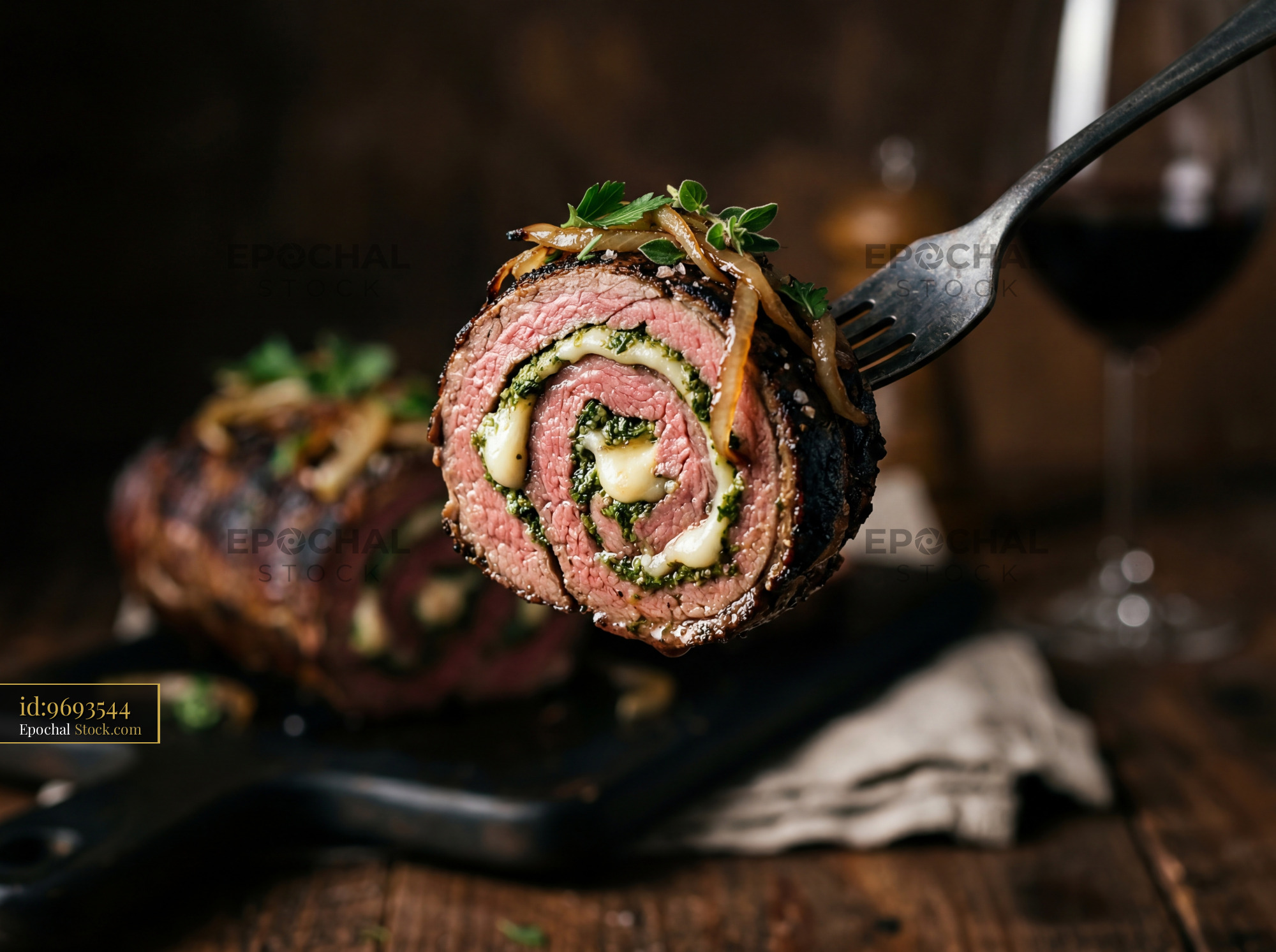 Herb-Filled Beef Roulade Slice on Fork - stock photo