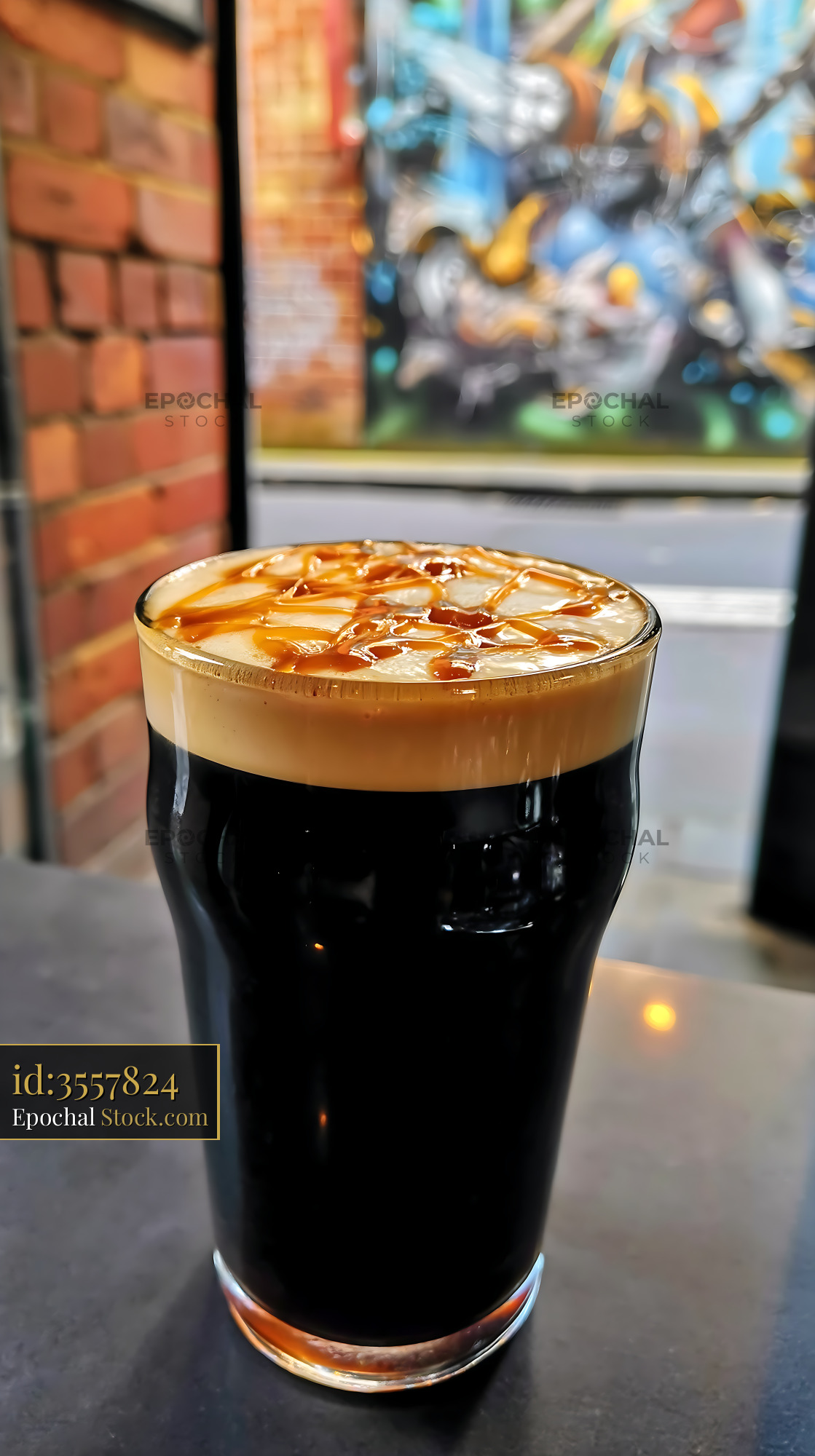 Nitro Caramel Coffee with Cascading Foam - stock photo