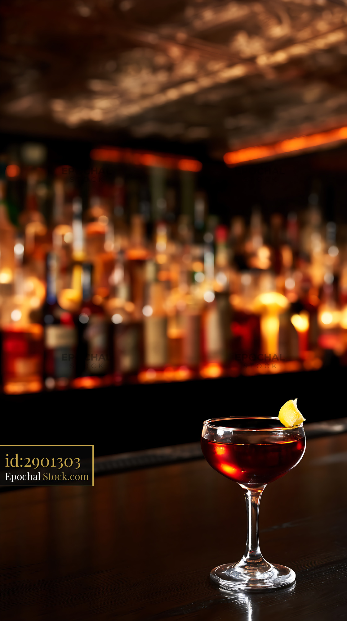 Bushwick Cocktail with Lemon Twist at Bar - stock photo