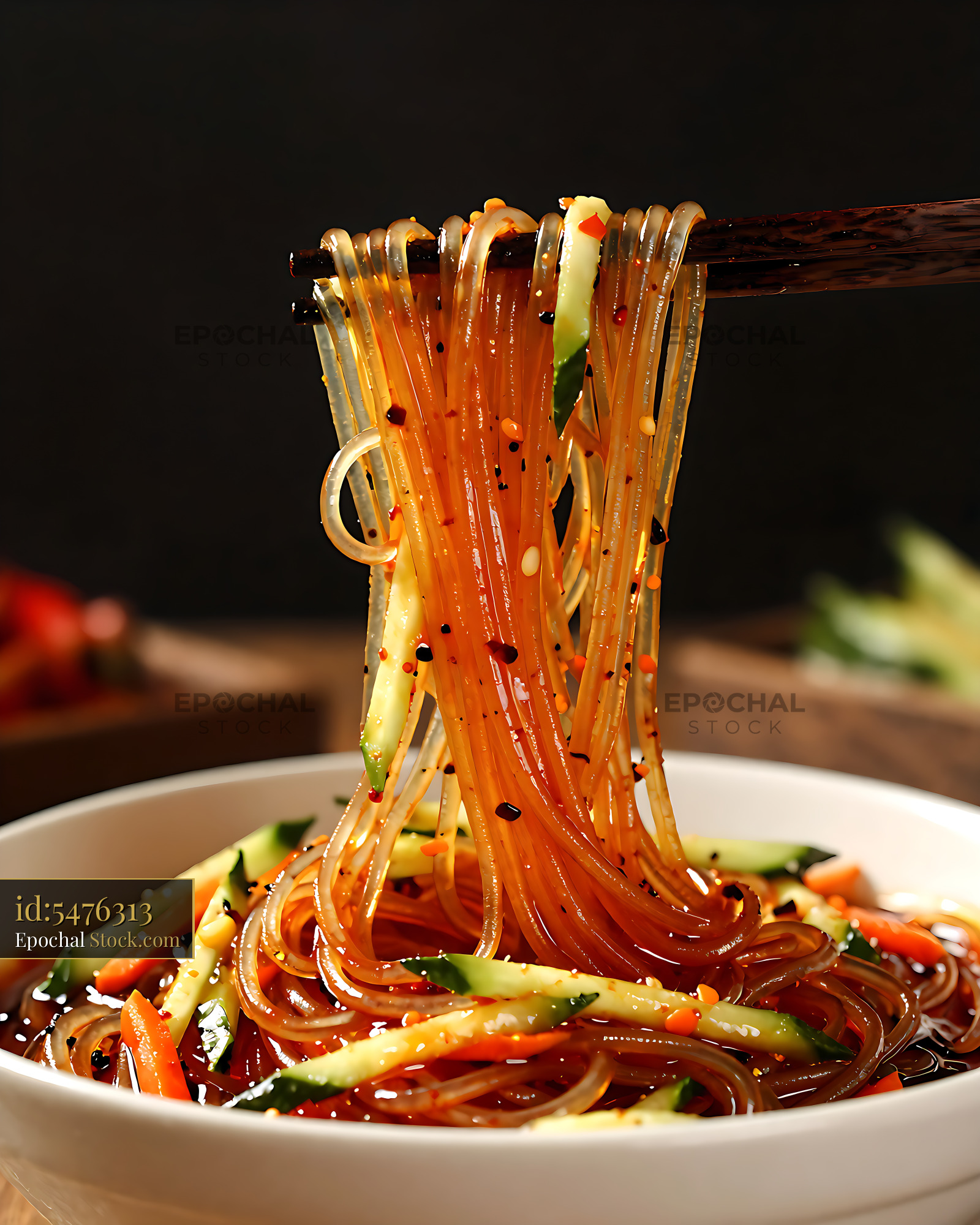 Spicy Noodles Lifted with Chopsticks - stock photo