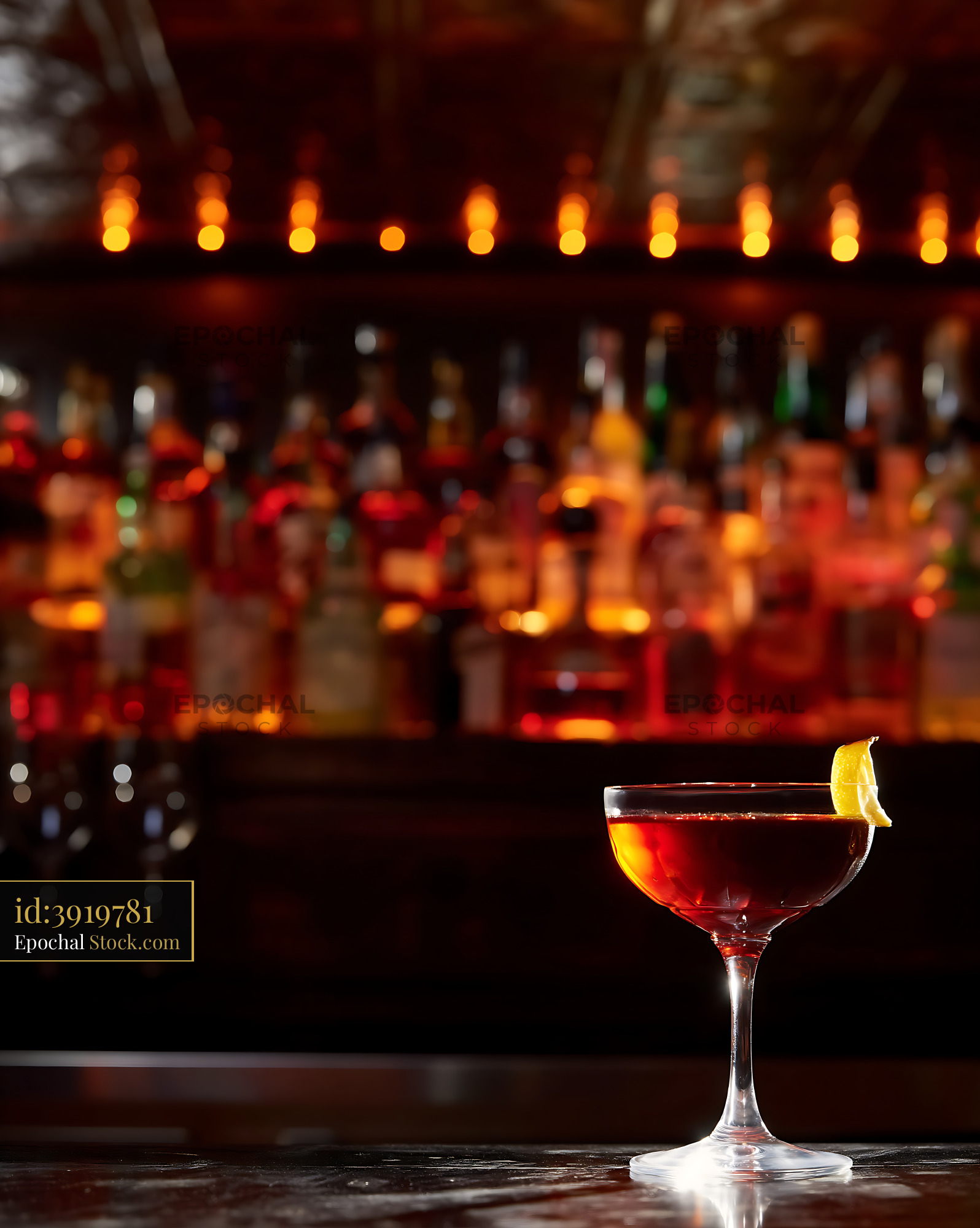 Bushwick Cocktail with Lemon Twist at Bar - stock photo