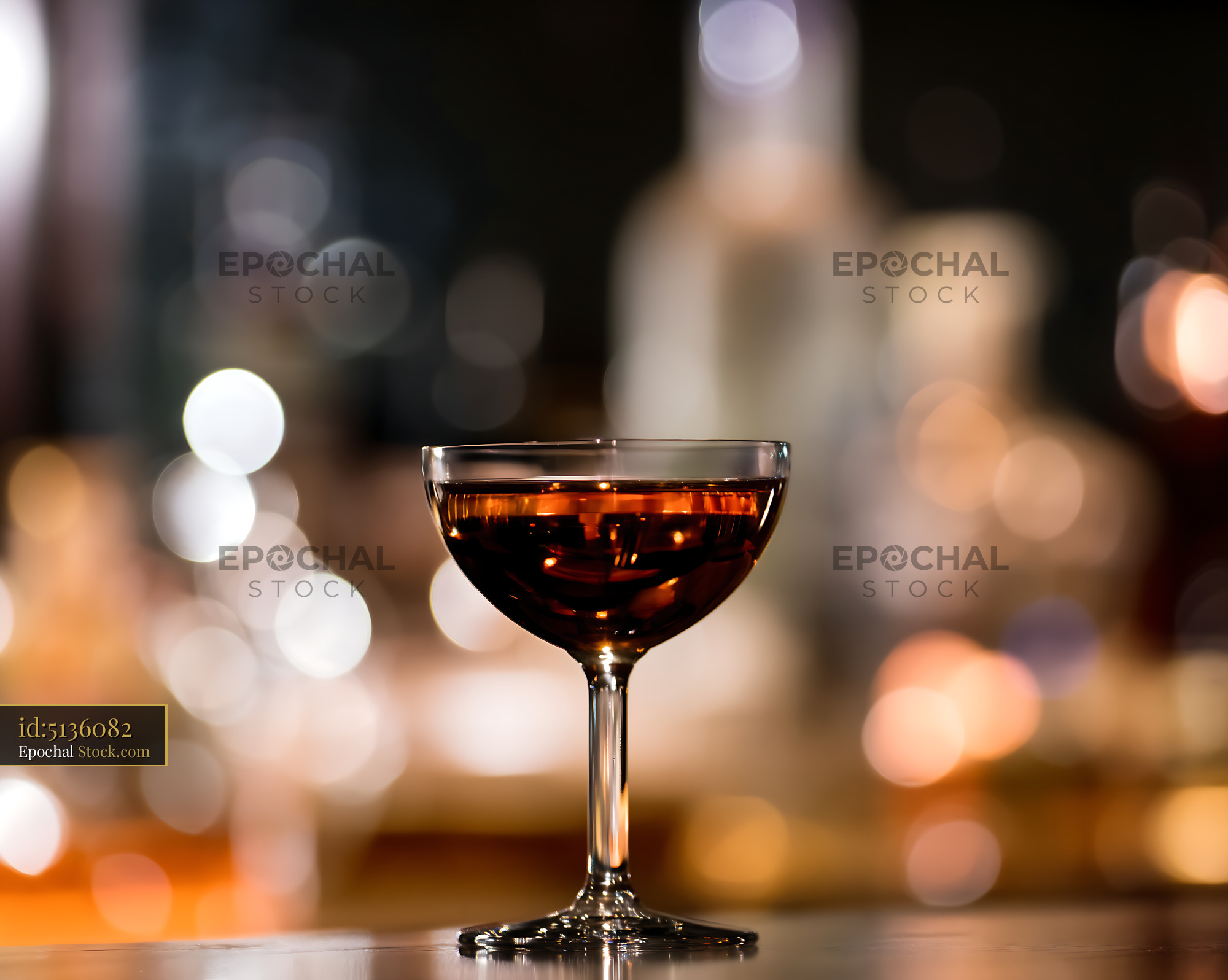 Bushwick Cocktail in Coupe Glass with Bar Bokeh - stock photo