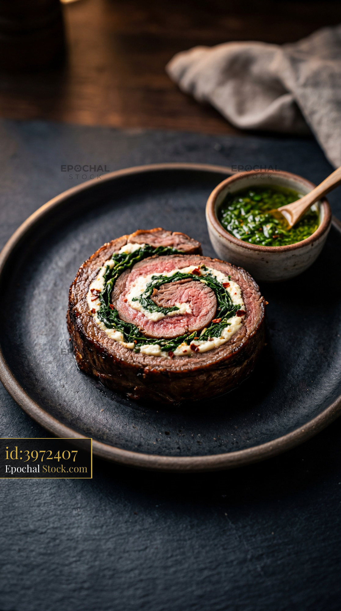Beef Roulade Slice with Spinach & Herb Sauce - stock photo