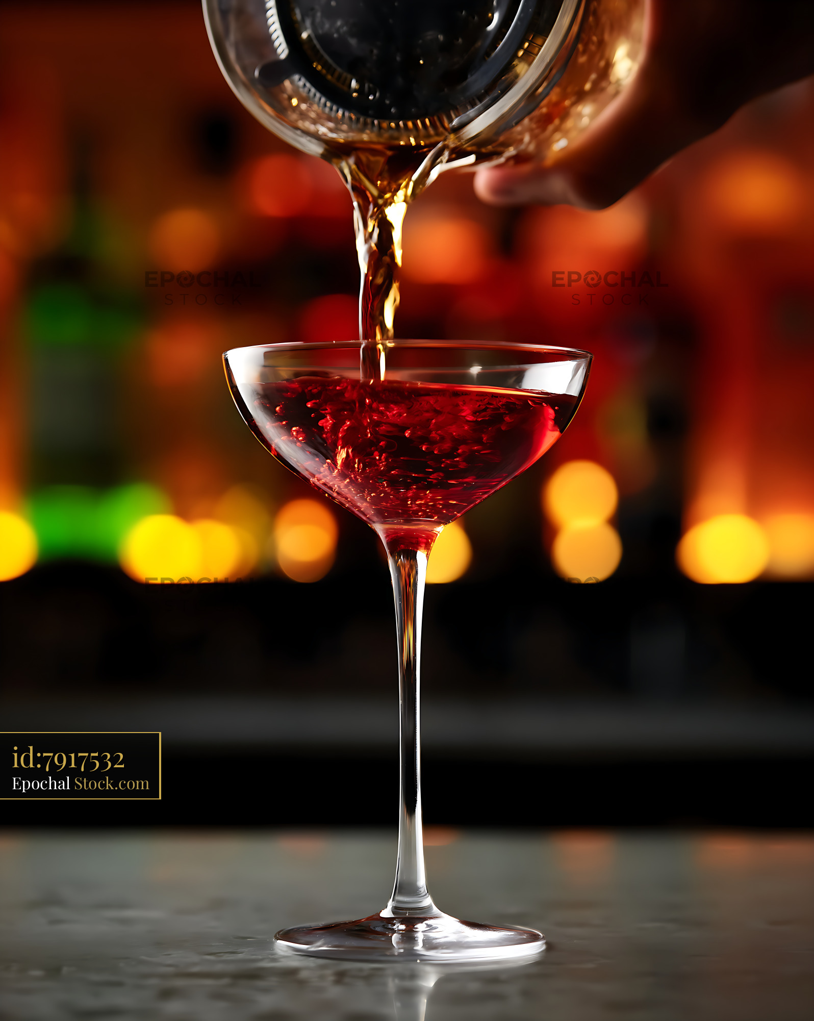Bushwick Cocktail Being Poured Into Coupe Glass - stock photo
