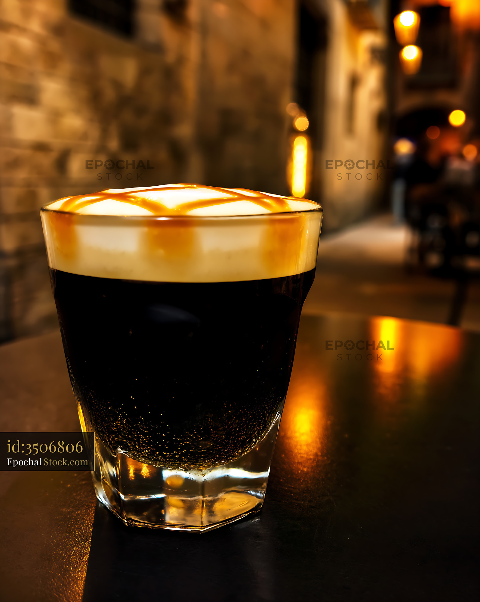 Nitro Caramel Coffee in Glass at Night - stock photo