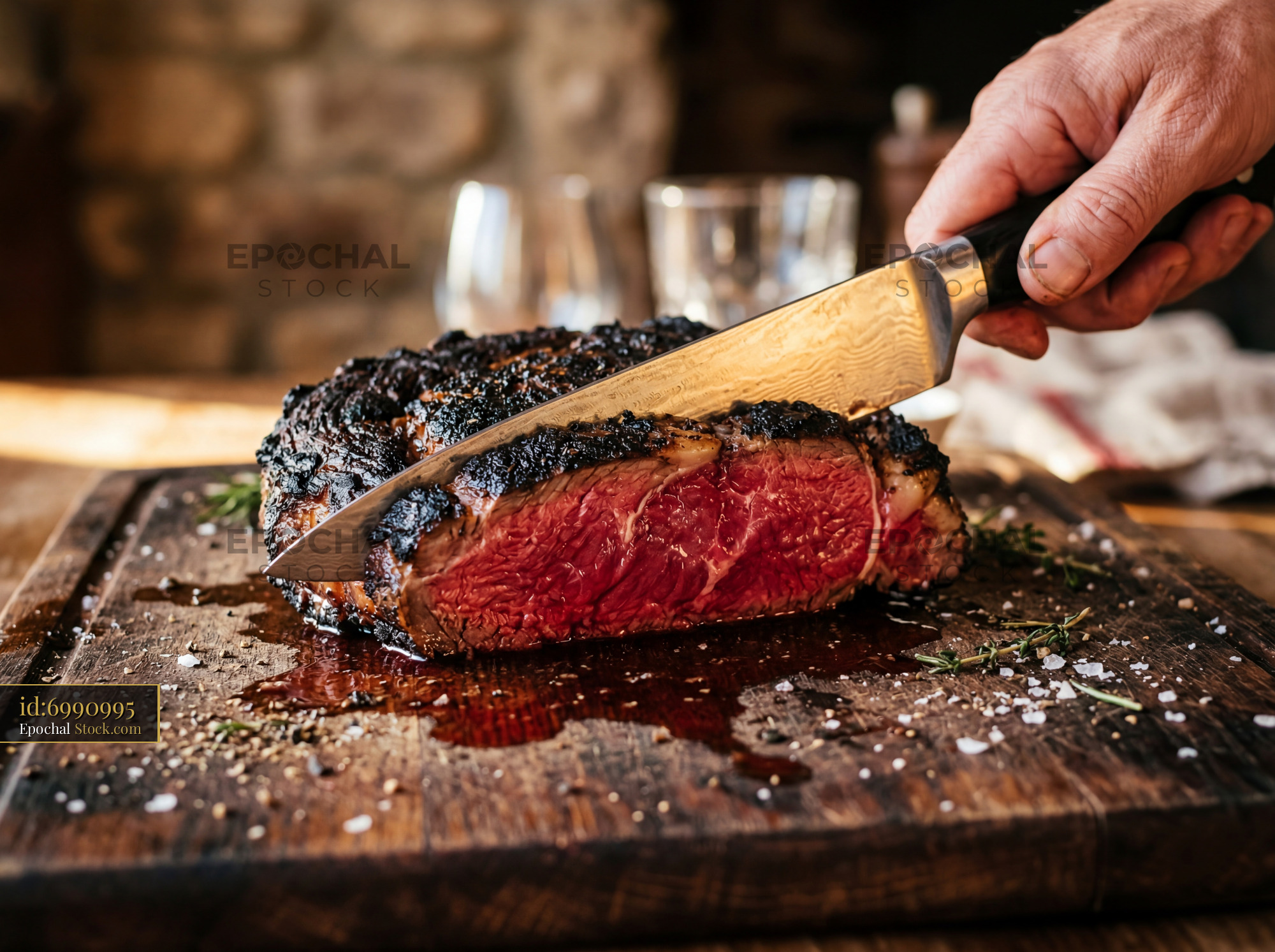 Premium Steak with Charred Crust Being Sliced - stock photo