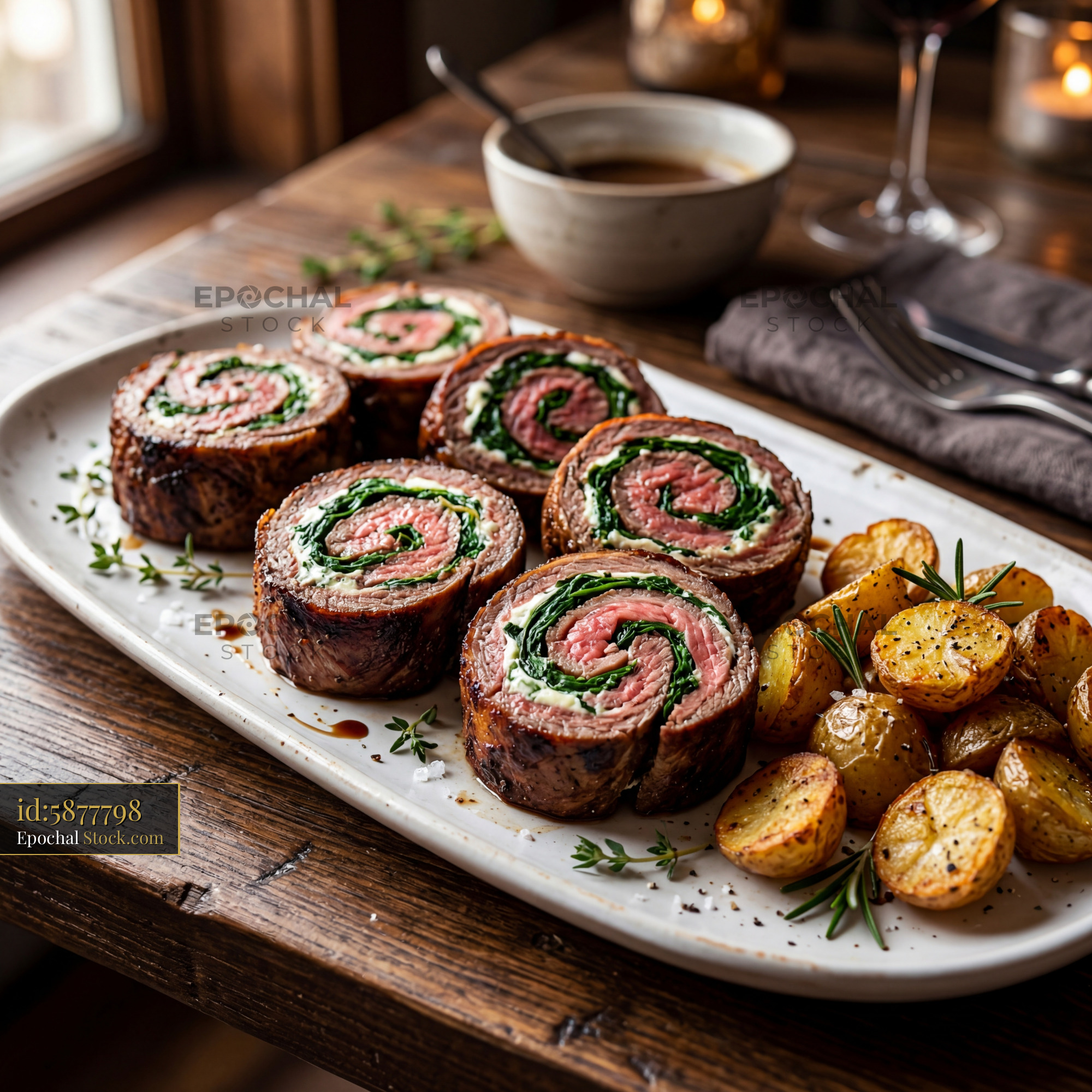 Sliced Beef Roulade with Spinach and Roasted Potatoes - stock photo
