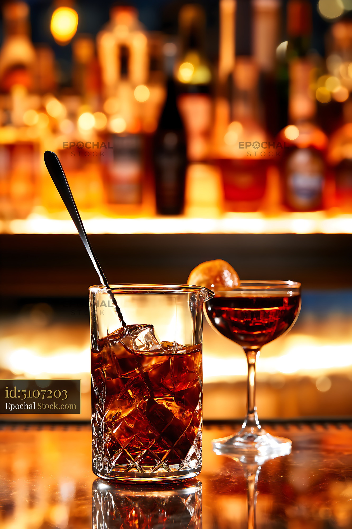 Cocktails on Bar Counter Golden Lighting - stock photo
