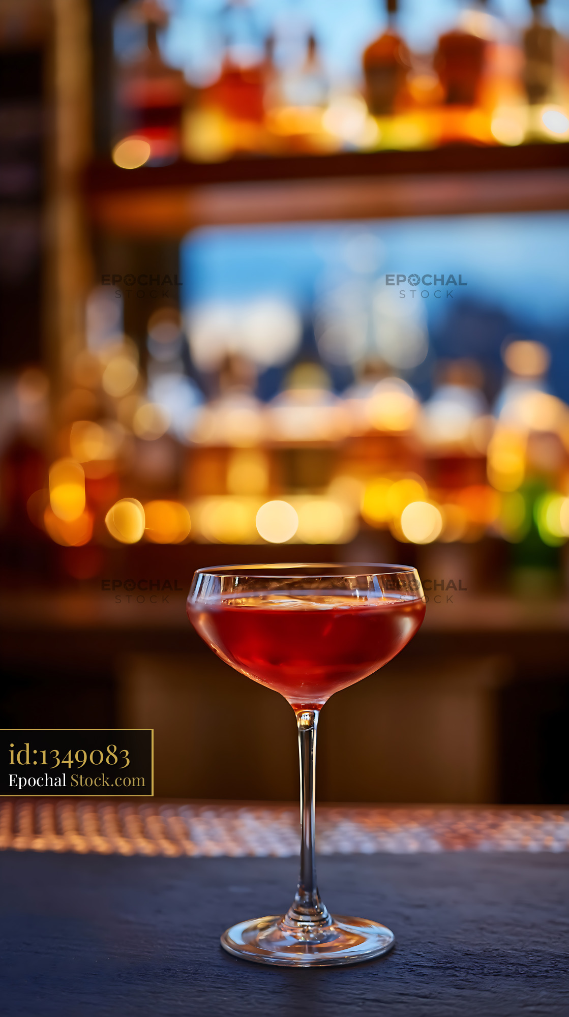 Bushwick Cocktail in Coupe Glass at Bar - stock photo