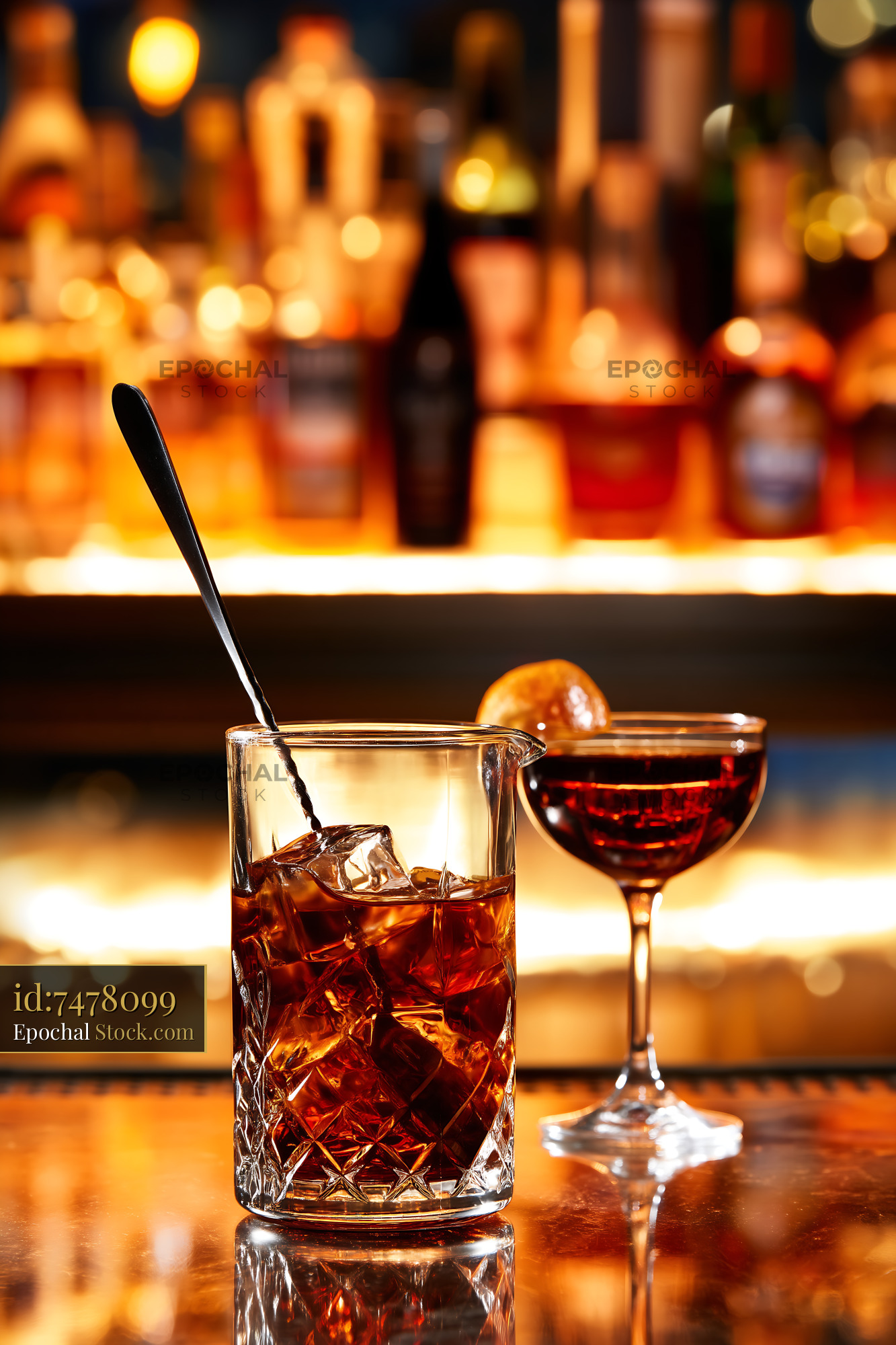 Cocktail Drink Being Stirred at Bar Counter - stock photo