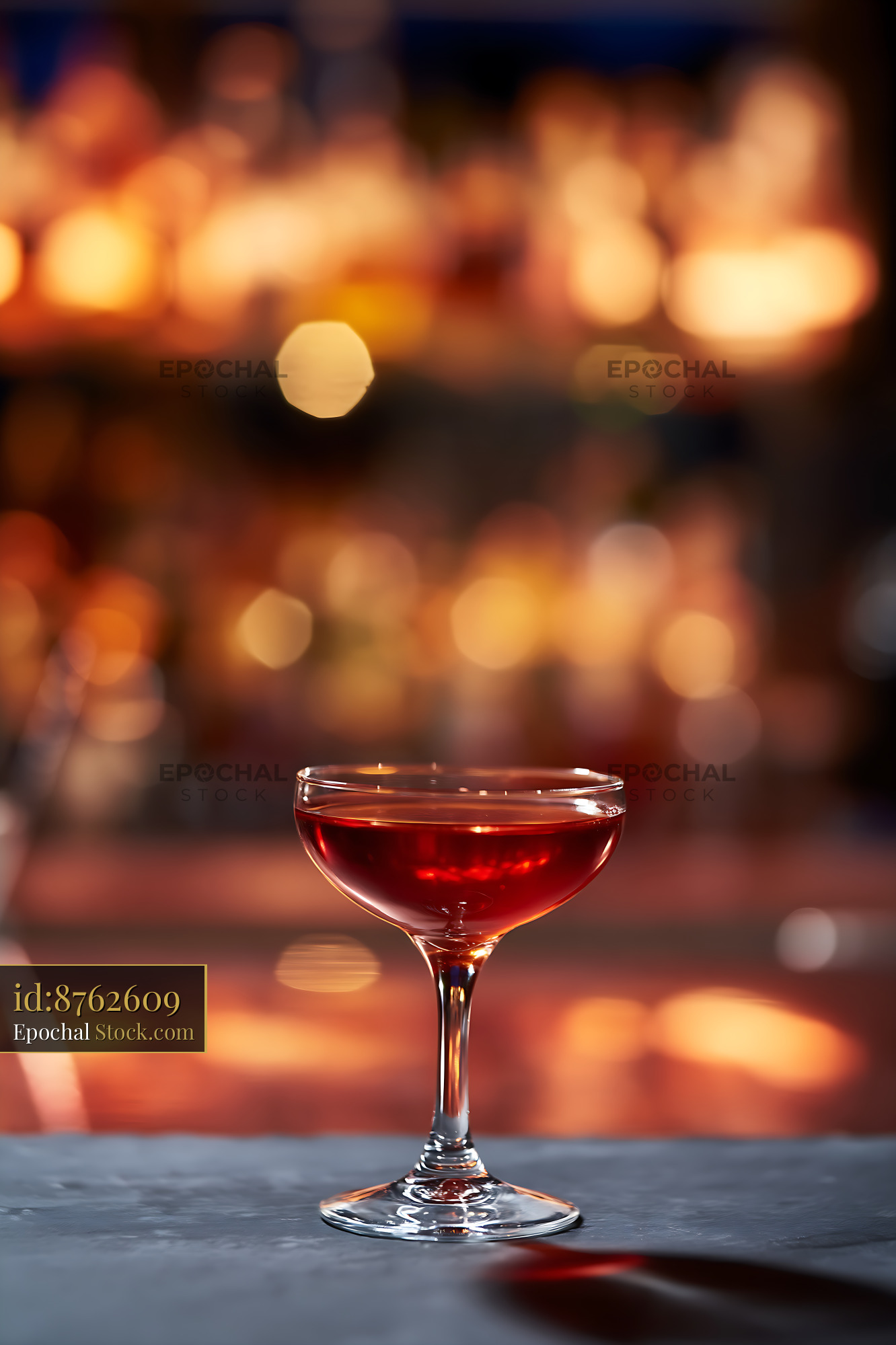 Bushwick Cocktail Glass with Warm Bar Lighting - stock photo