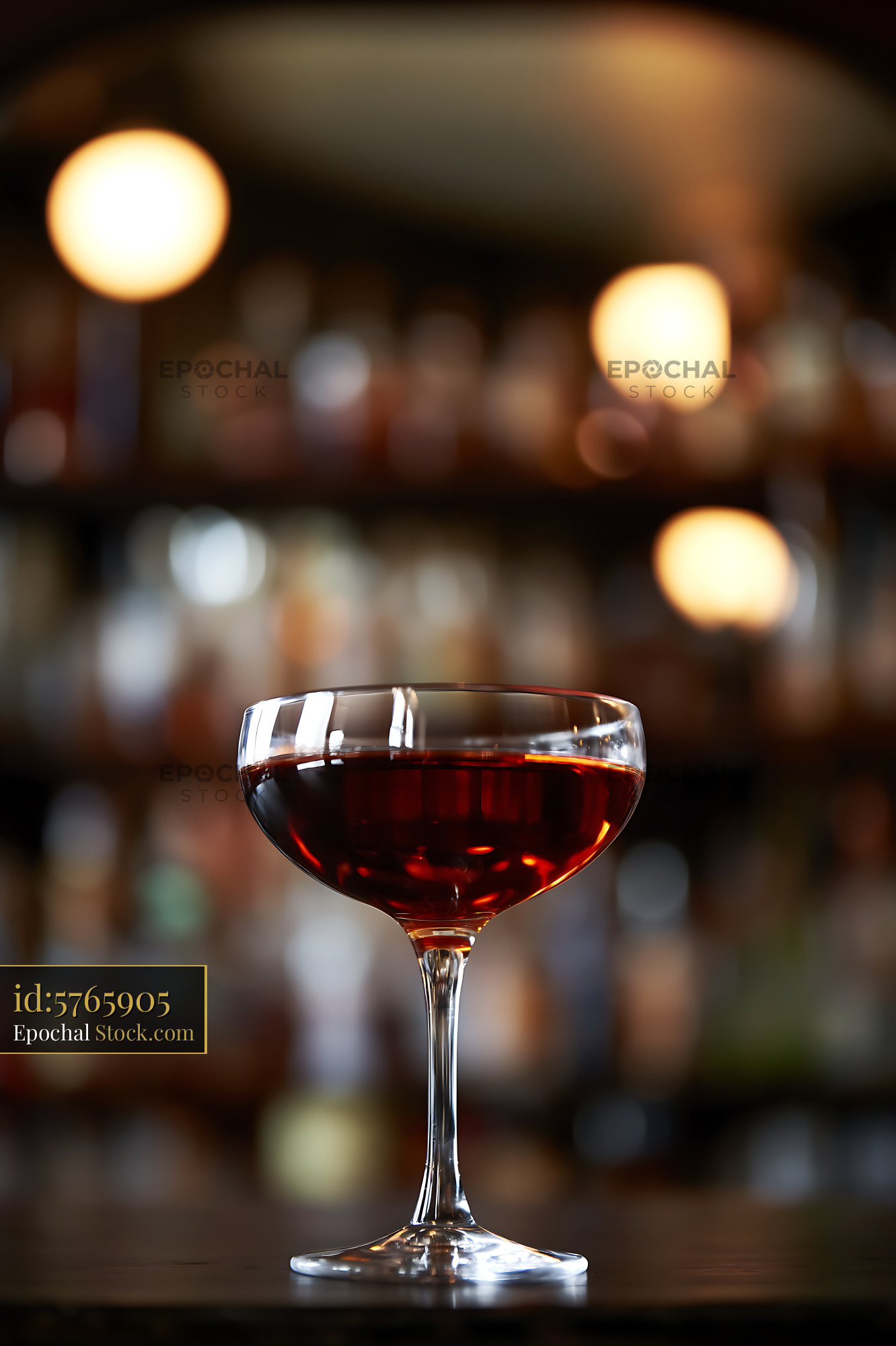 Bushwick Cocktail in Coupe Glass at Bar - stock photo