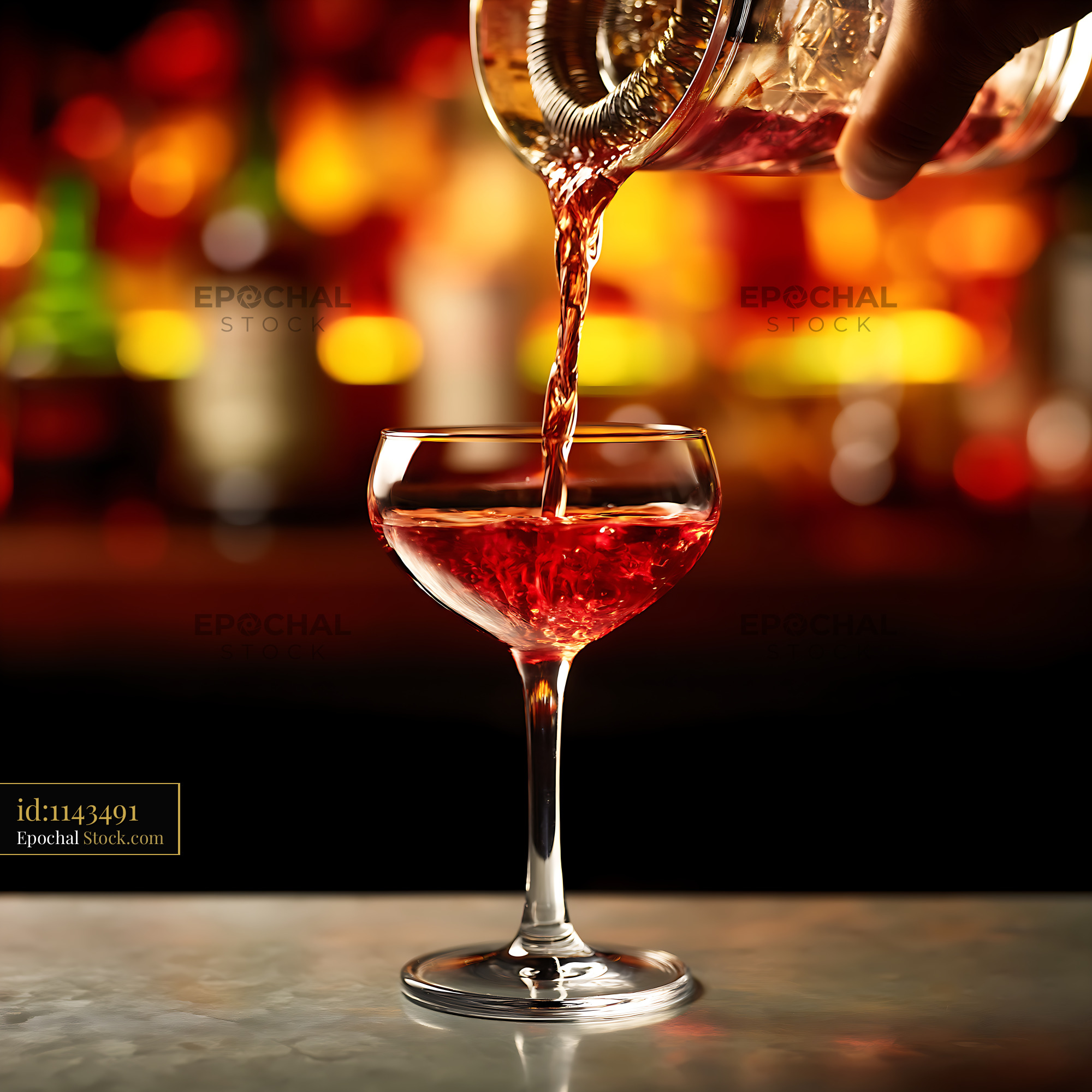 Bushwick Cocktail Being Poured Into Coupe Glass - stock photo