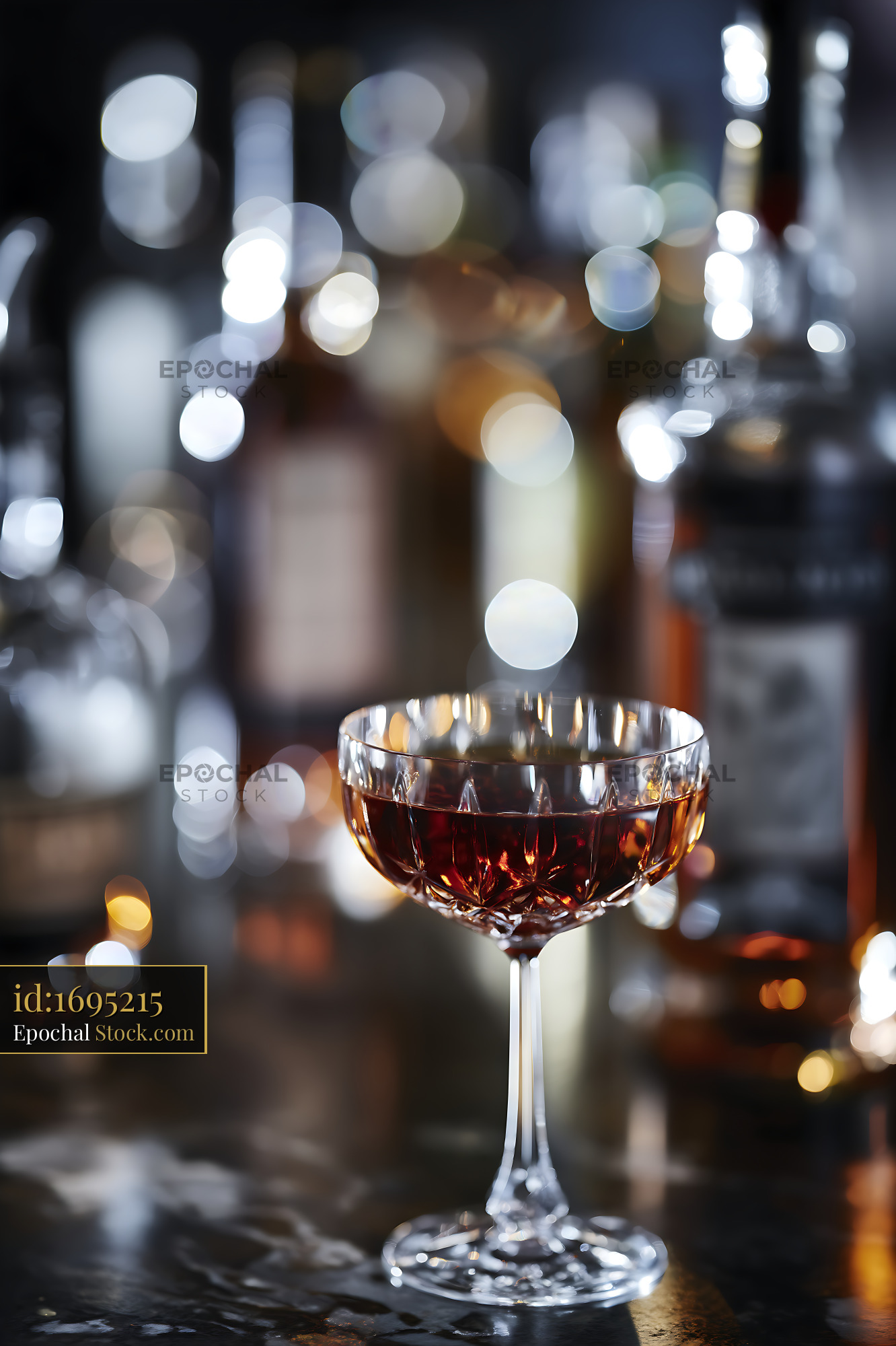 Bushwick Cocktail in Coupe Glass at Bar - stock photo