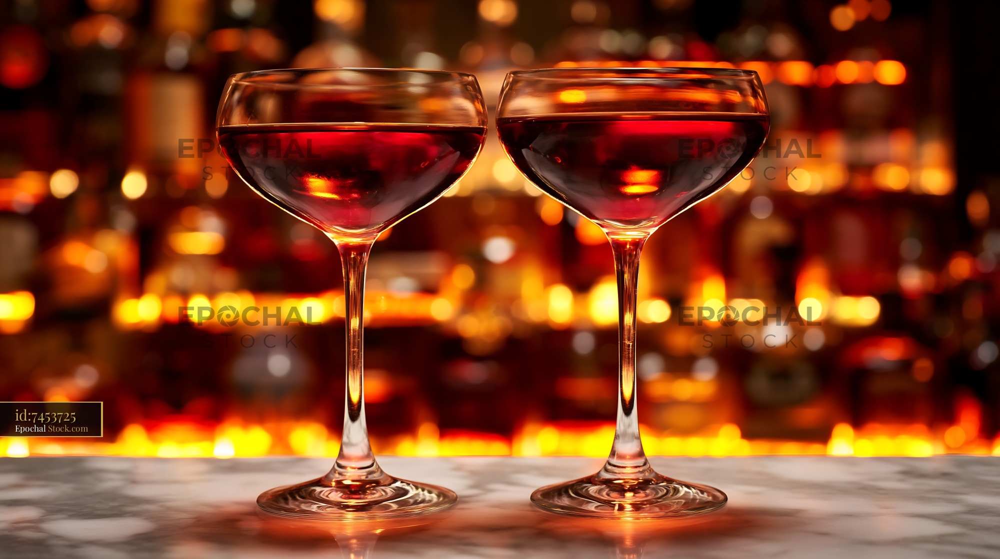 Two Red Wine Coupes, Romantic Evening Bokeh - stock photo