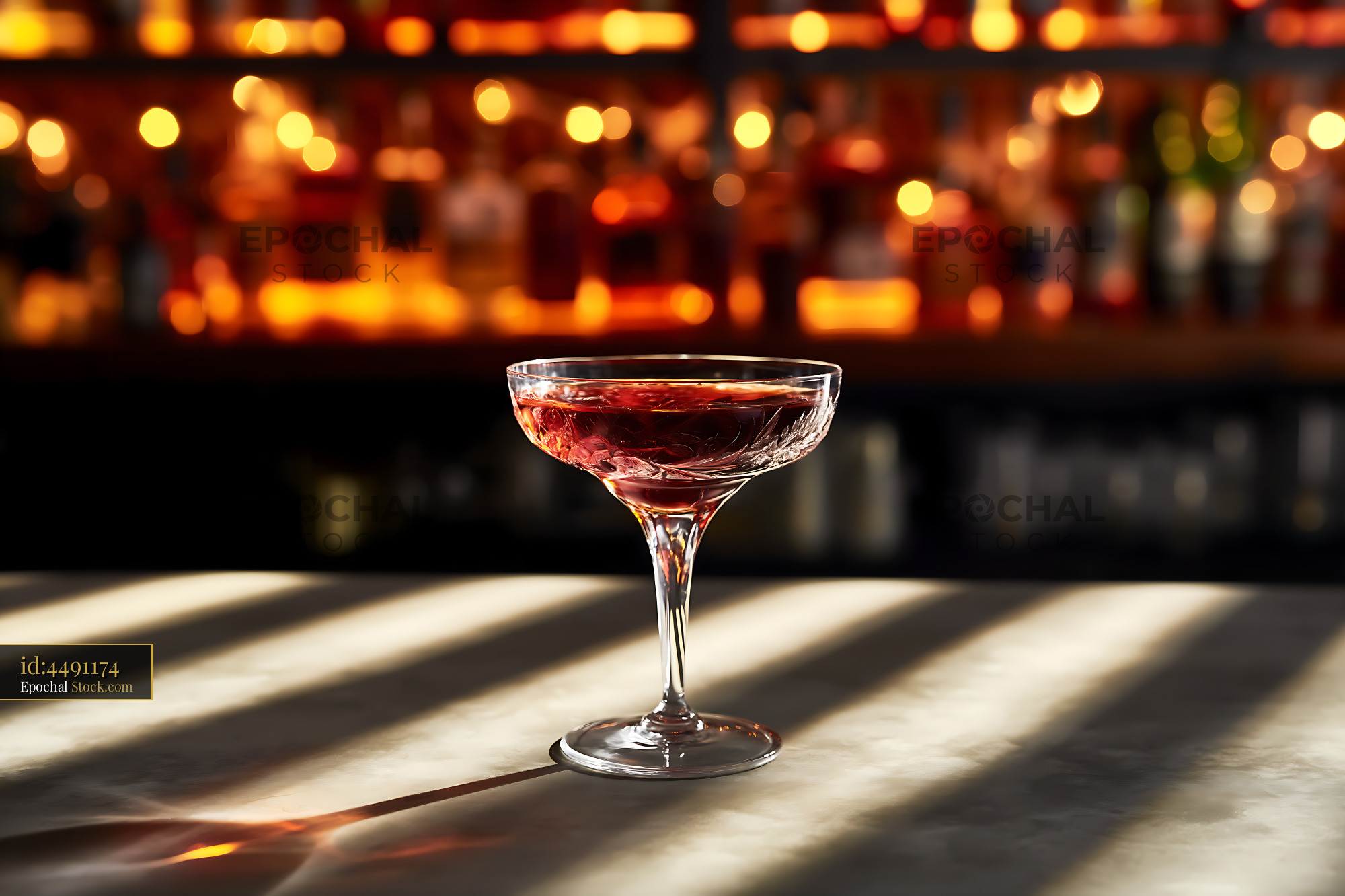 Bushwick Cocktail in Coupe Glass at Bar - stock photo