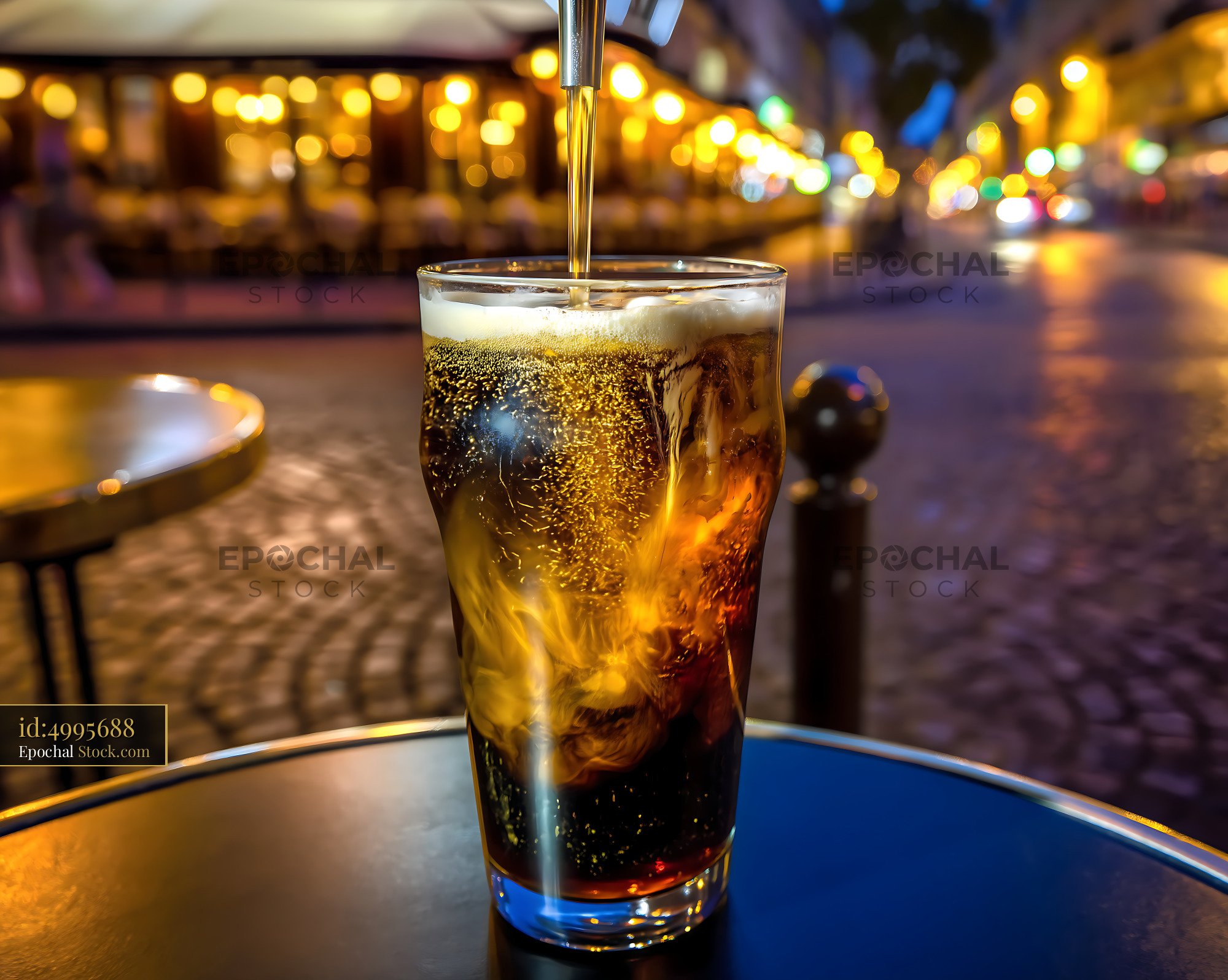 Nitro Caramel Coffee Pouring Into Glass at Cafe - stock photo