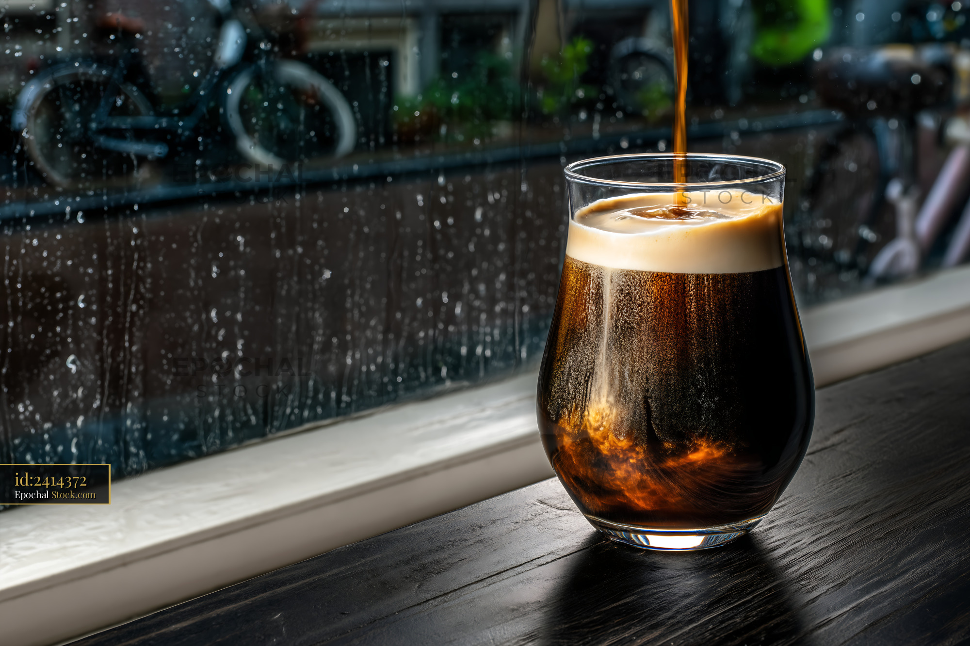 Soda Pour on Rainy Day Patio - stock photo