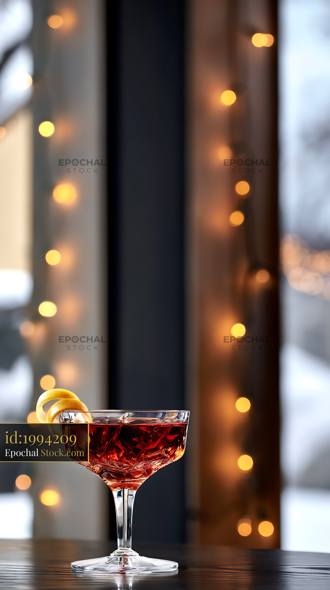 Saratoga Cocktail with Lemon Twist Bokeh Lights - stock photo