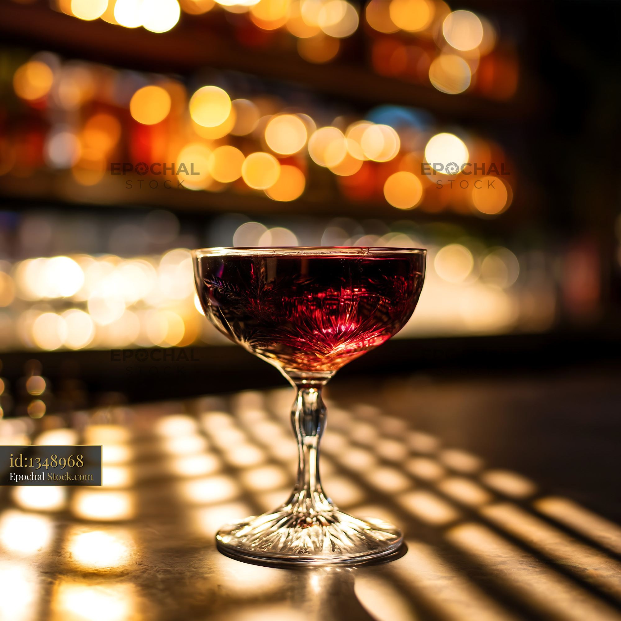 Burgundy Cocktail in Elegant Coupe Glass at Bar - stock photo