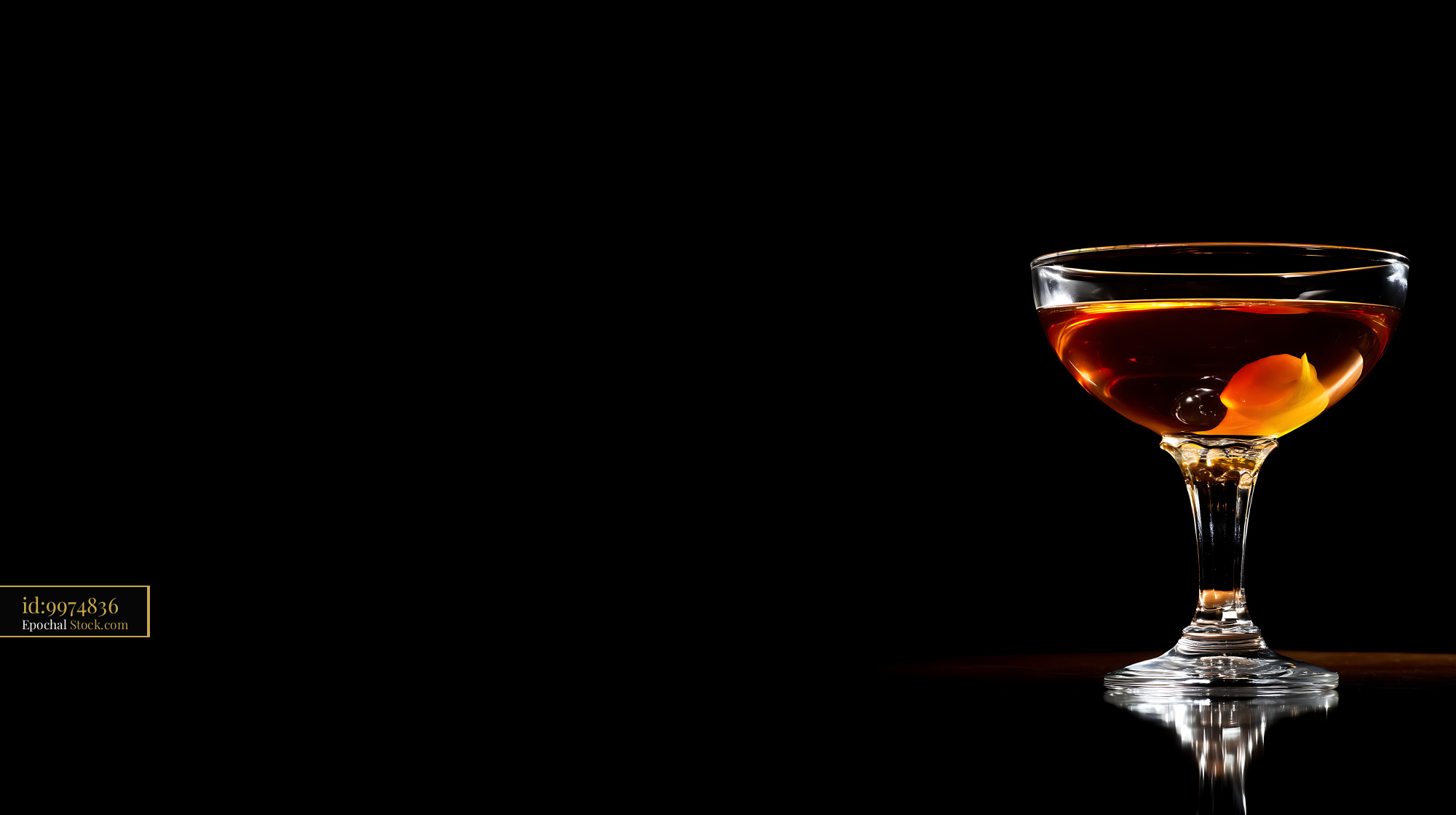 Saratoga Cocktail with Orange Twist on Black - stock photo