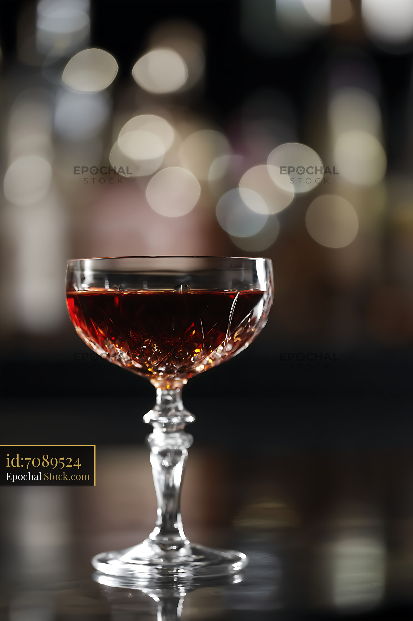 Bushwick Cocktail in Coupe Glass Against Bokeh - stock photo