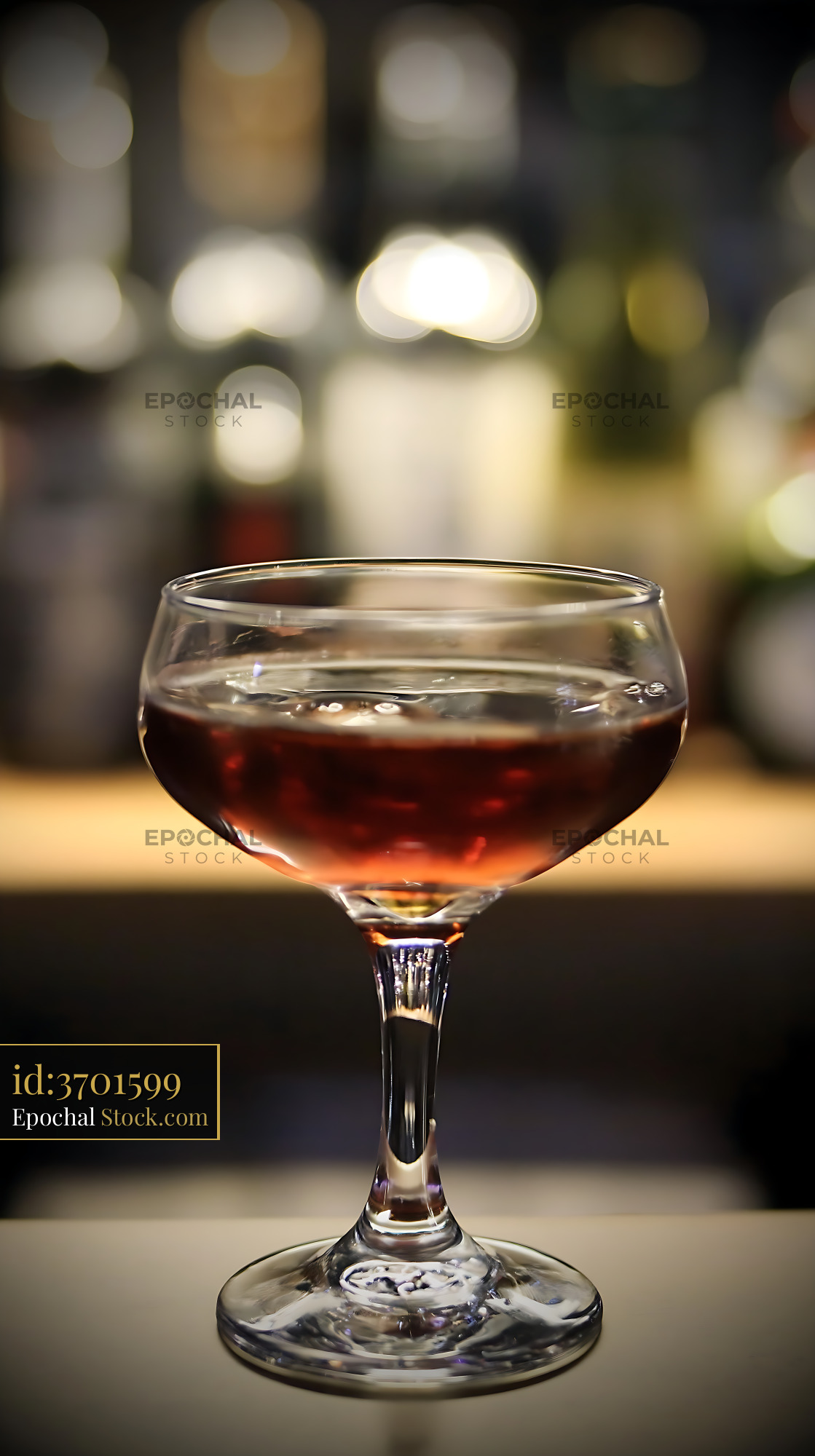 Bushwick Cocktail in Coupe Glass at Bar - stock photo