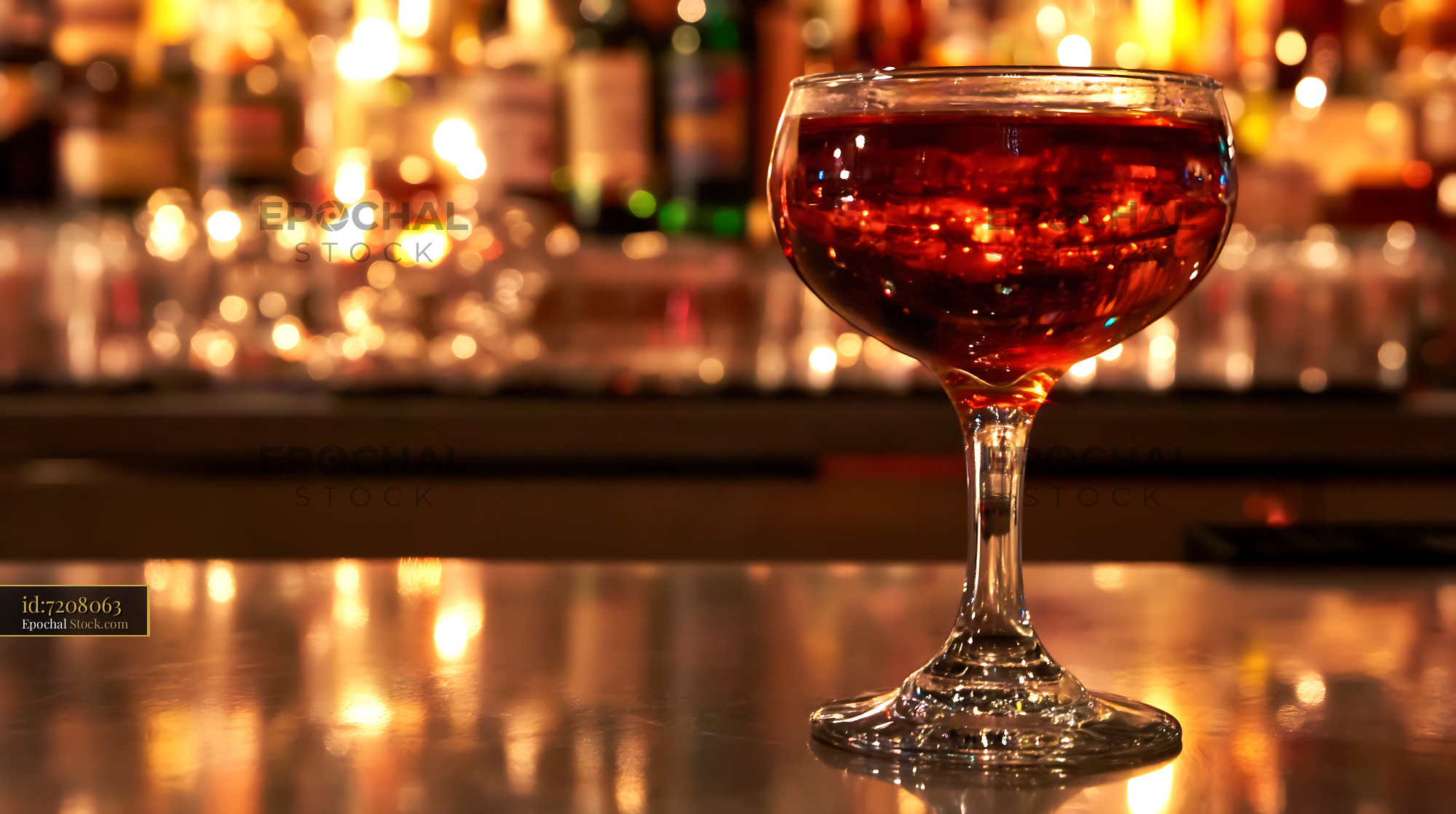 Bushwick Cocktail in Coupe Glass at Bar - stock photo