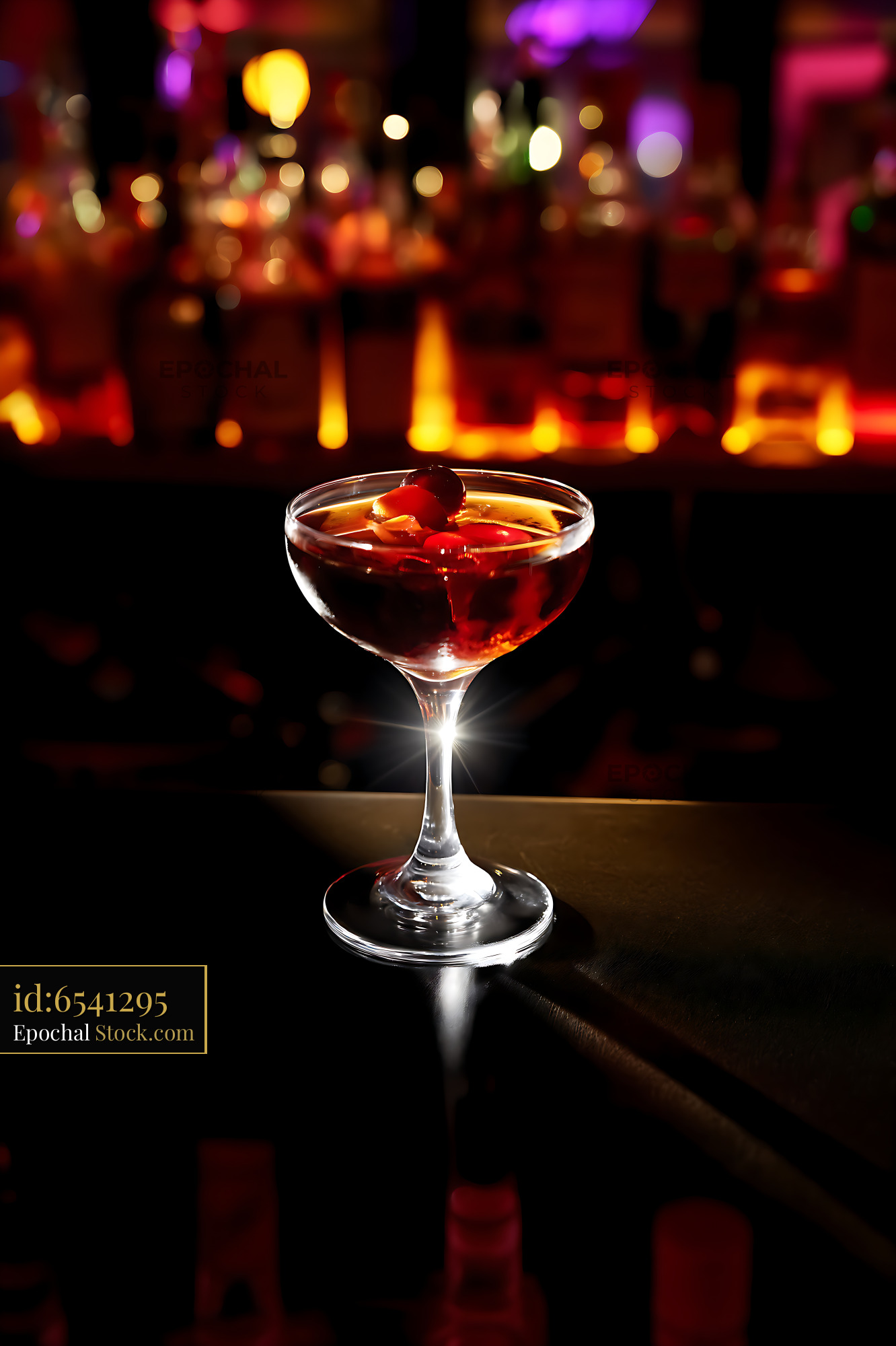 Crimson Cocktail Glowing at Neon Nightclub Bar - stock photo