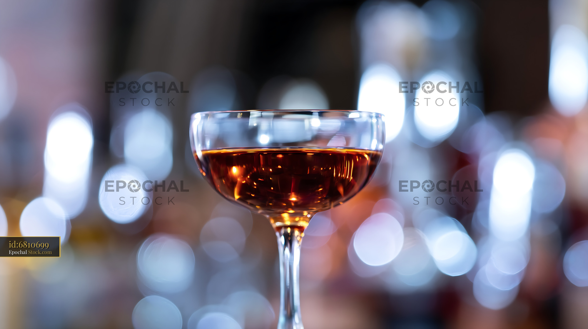 Bushwick Cocktail in Coupe Glass with Bar Lights - stock photo