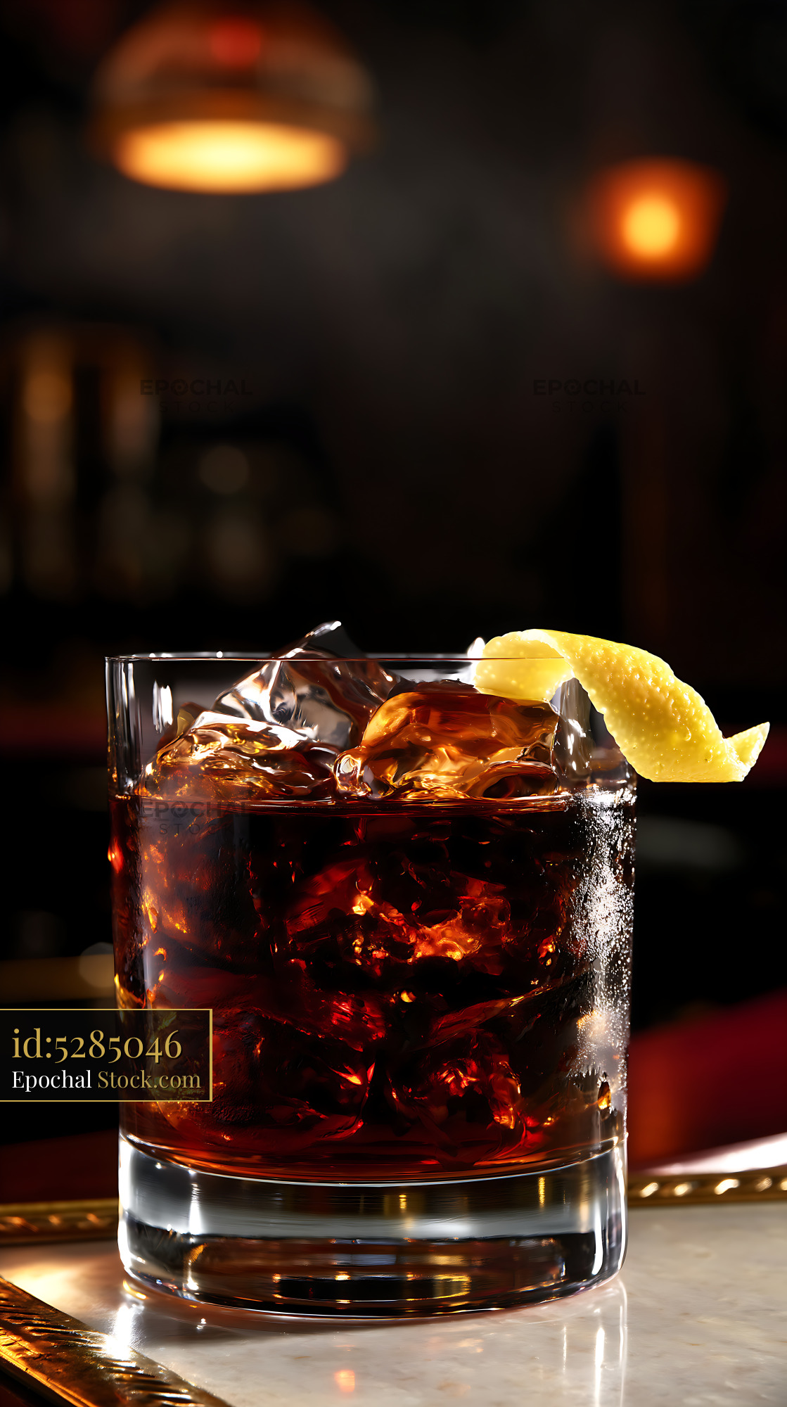 Saratoga Cocktail with Lemon Garnish at Bar - stock photo