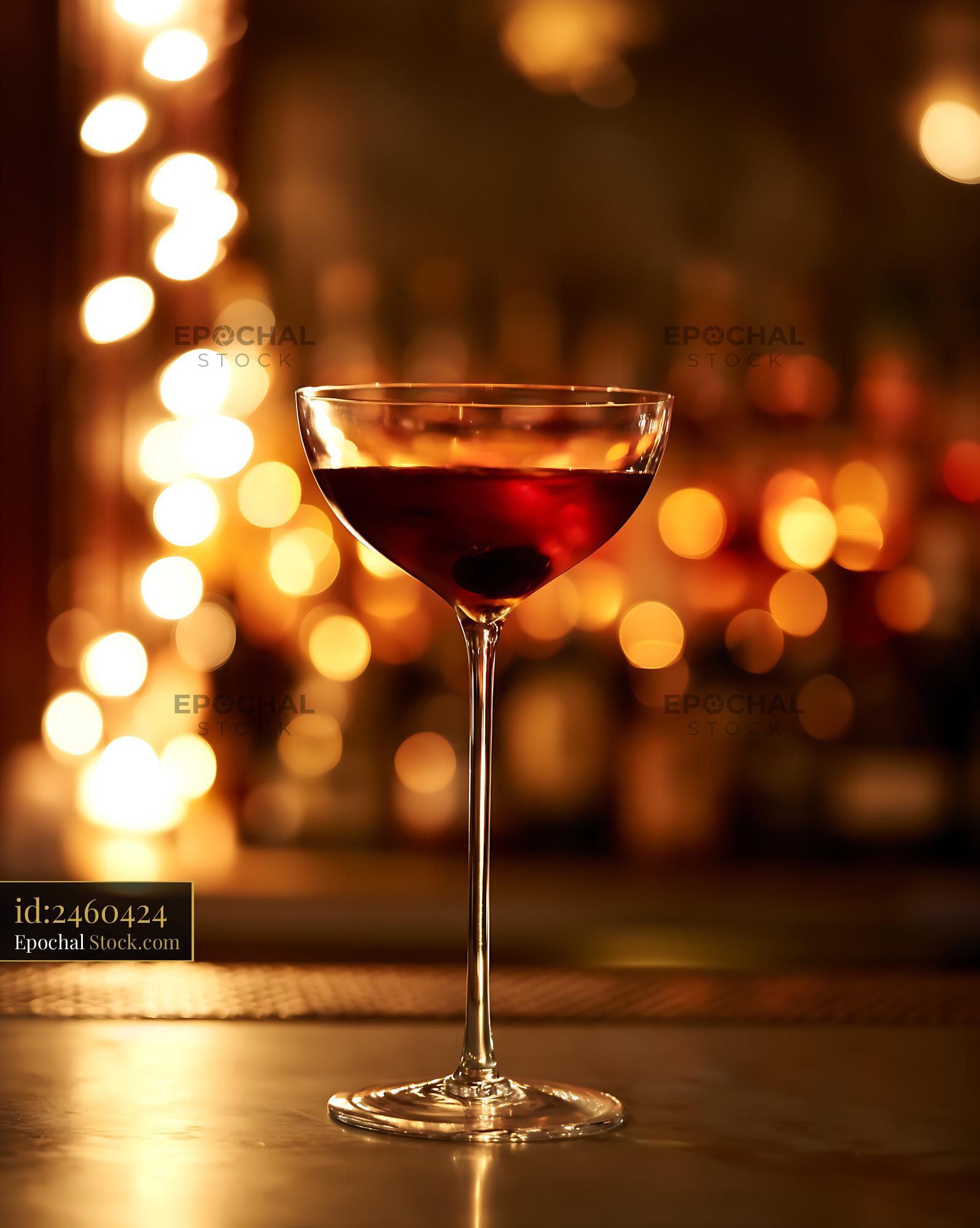 Bushwick Cocktail in Coupe Glass at Bar - stock photo