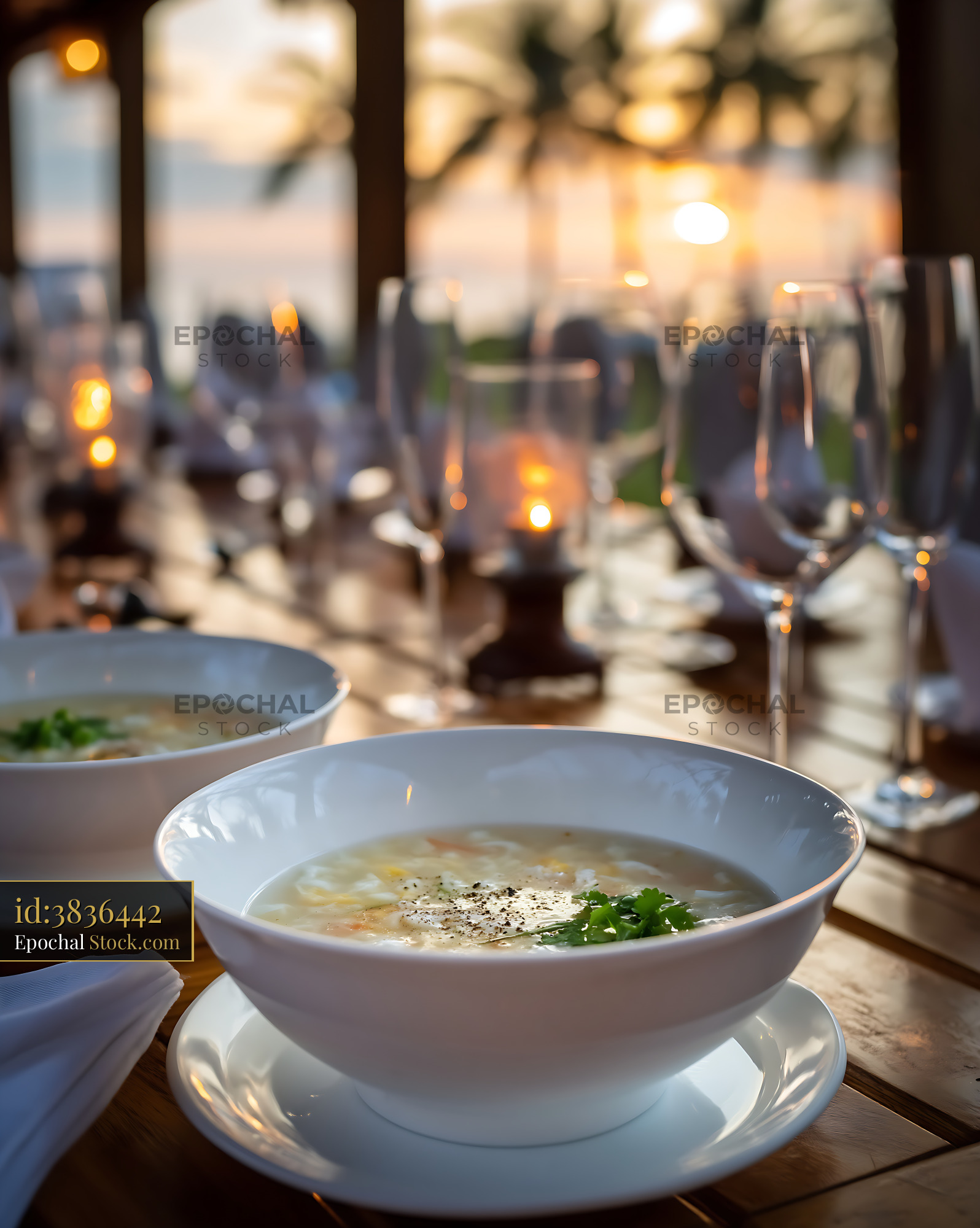 Sup Mang Cua Soup Served at Sunset Dinner Table - stock photo