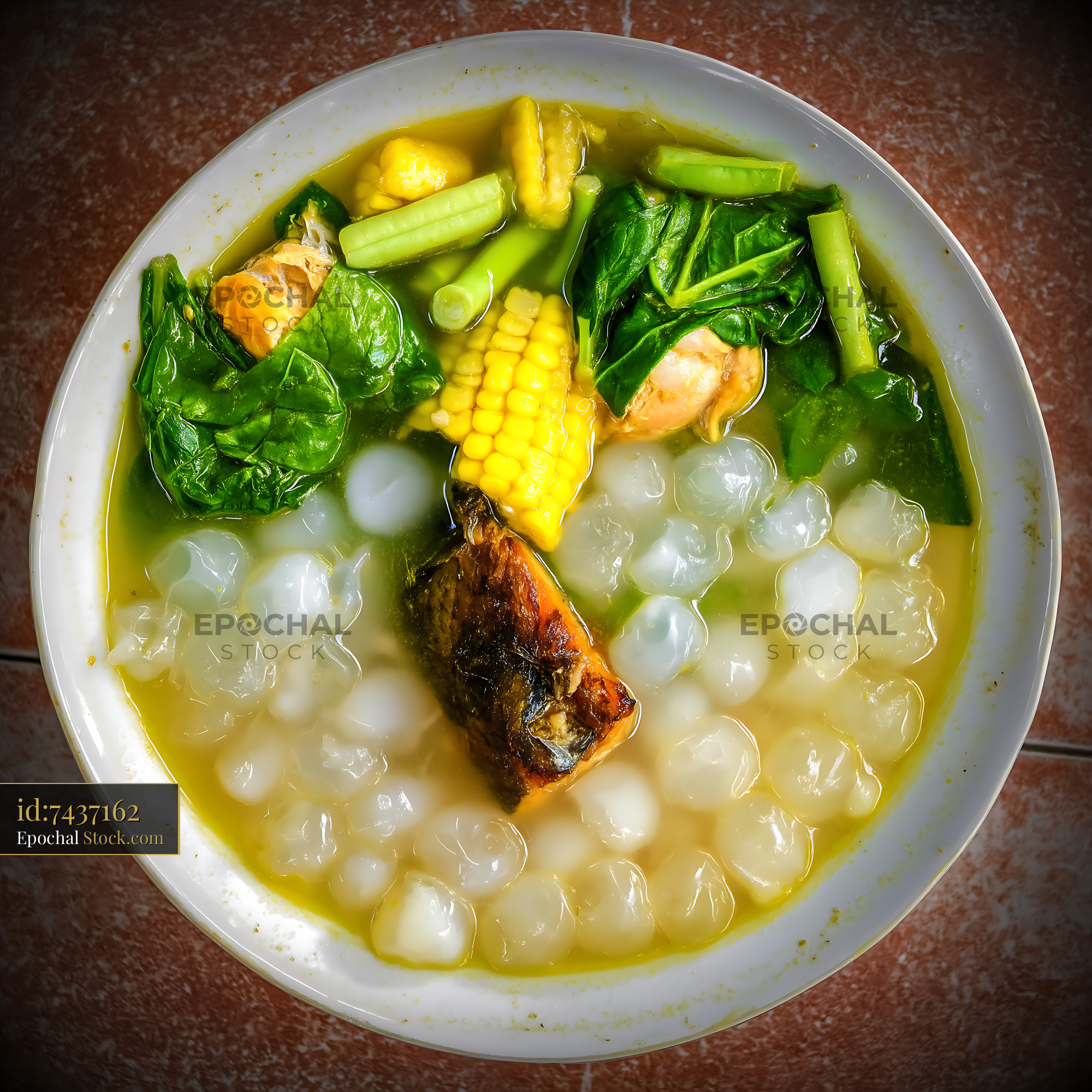 Lor Mee Soup with Fish, Corn, and Greens - stock photo