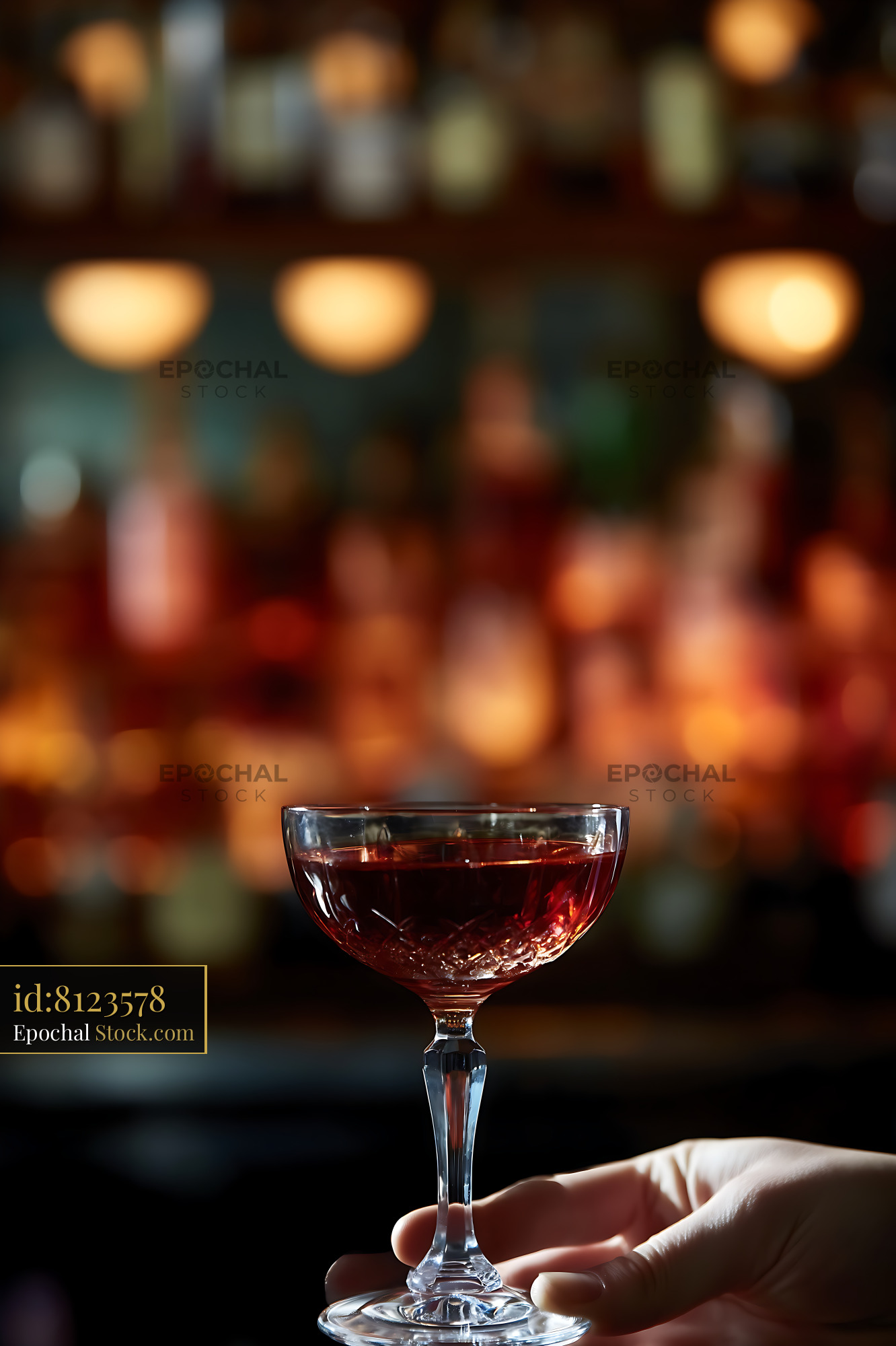 Red Bushwick Cocktail Held at Bar - stock photo