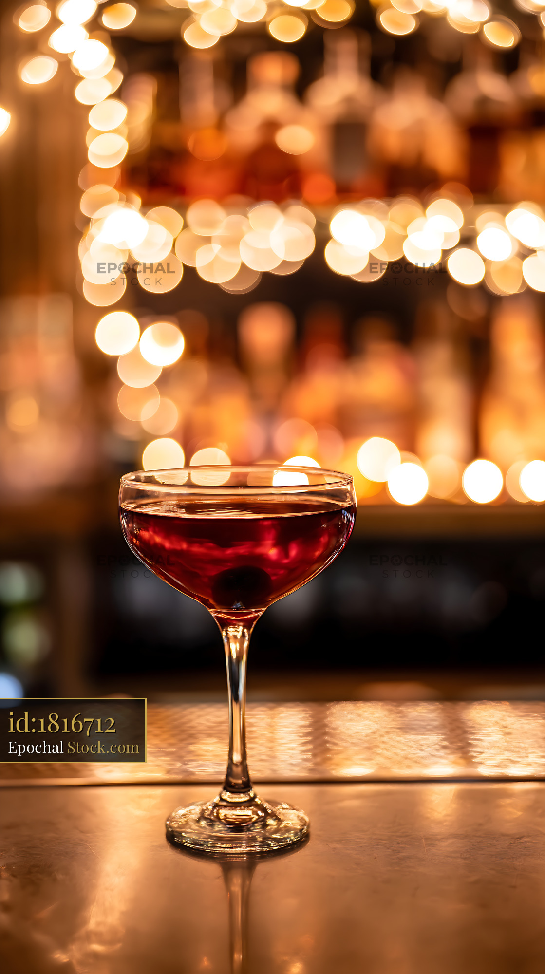 Bushwick Cocktail on Bar Counter with Warm Bokeh - stock photo