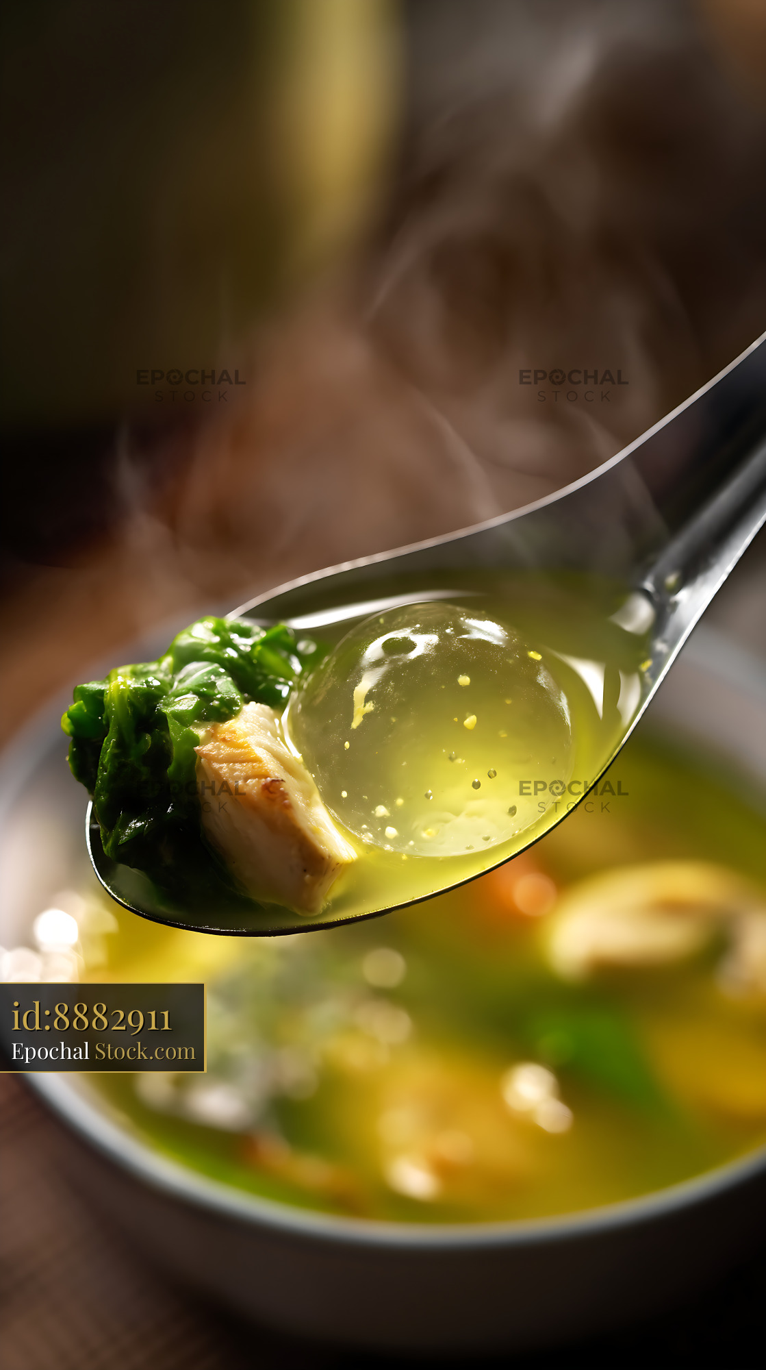 Steaming Kapurung Soup [Adobe ] Spoonful of Greens - stock photo