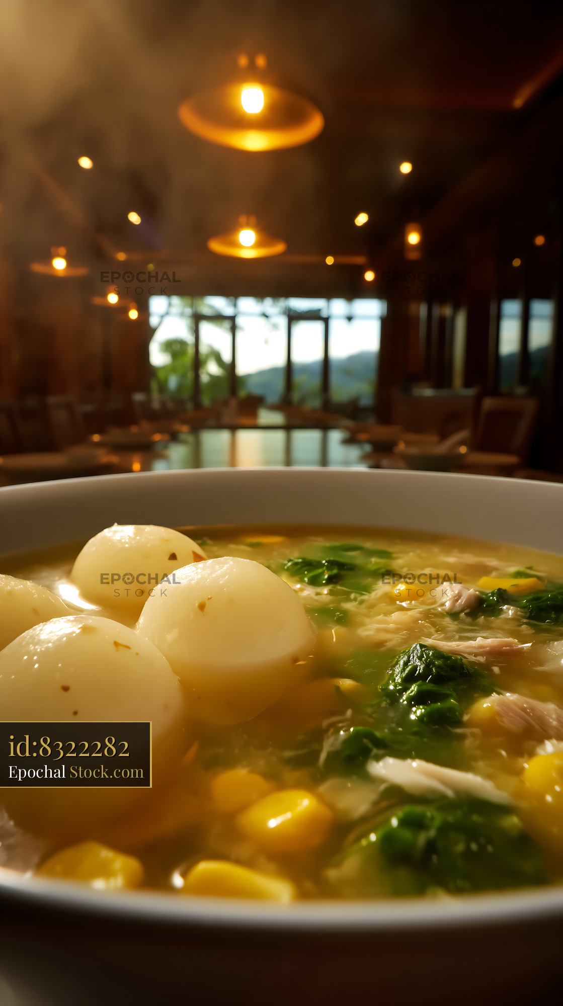 Steaming Kapurung Soup in Scenic Restaurant Setting - stock photo