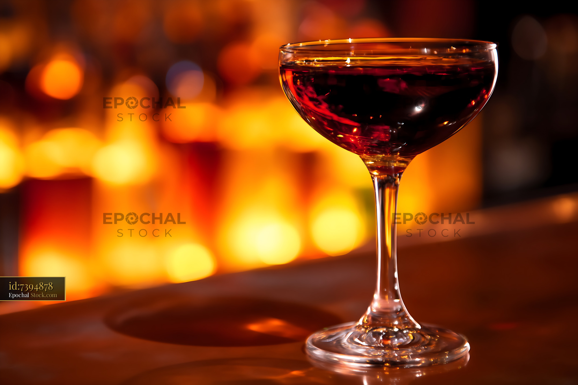 Bushwick Cocktail in Coupe Glass with Warm Bokeh - stock photo