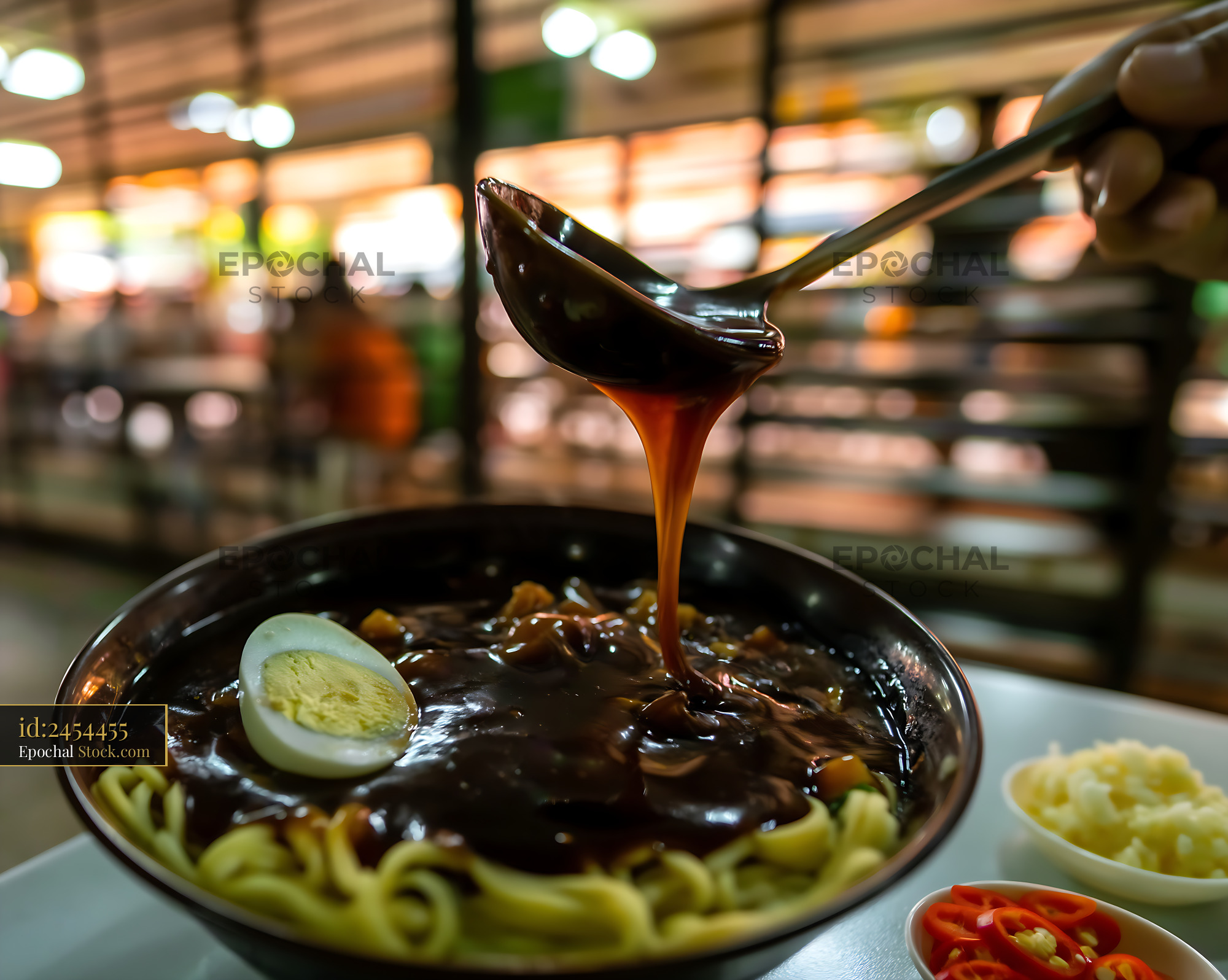 Lor Mee Soup with Sauce Poured in a Food Stall - stock photo