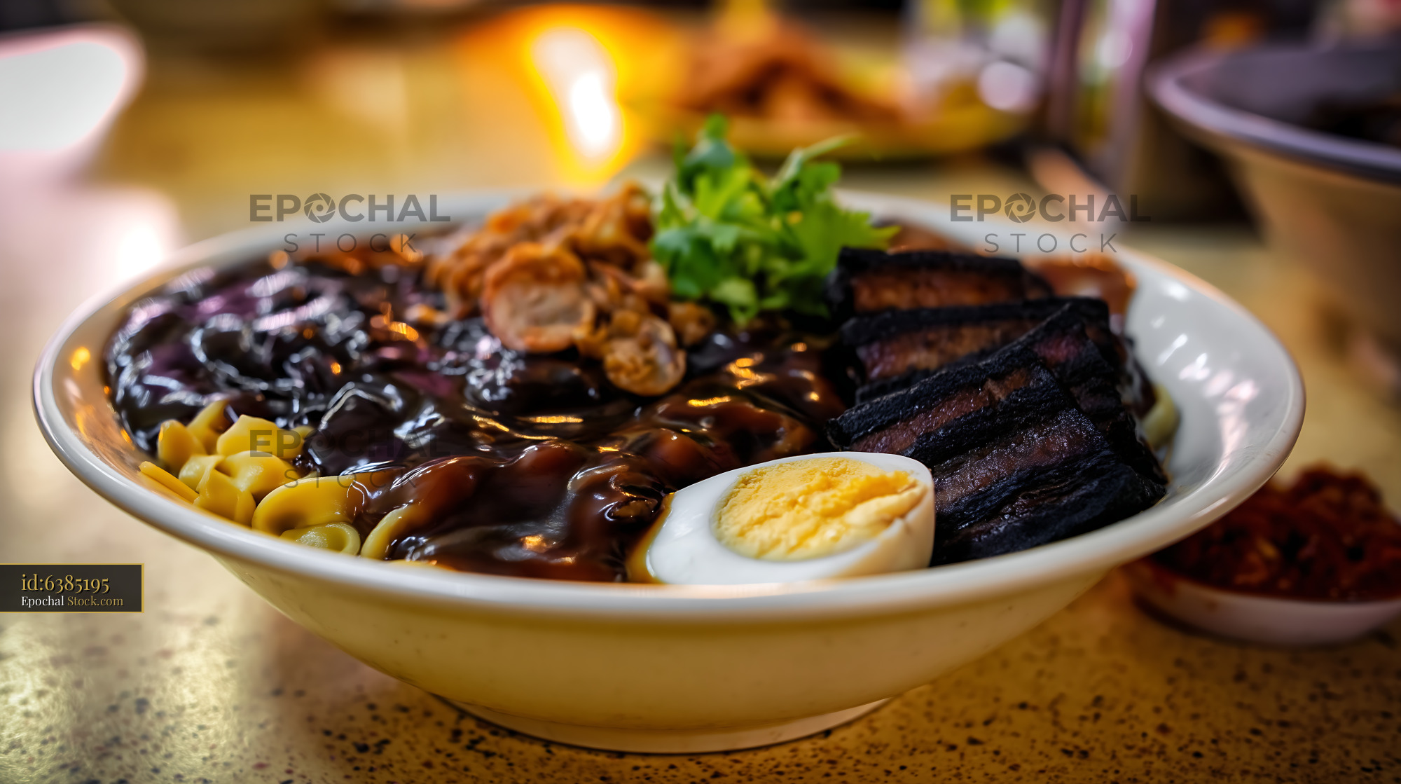 Savory Dark Sauce Noodles with Pork Belly and Egg in Eatery - stock photo