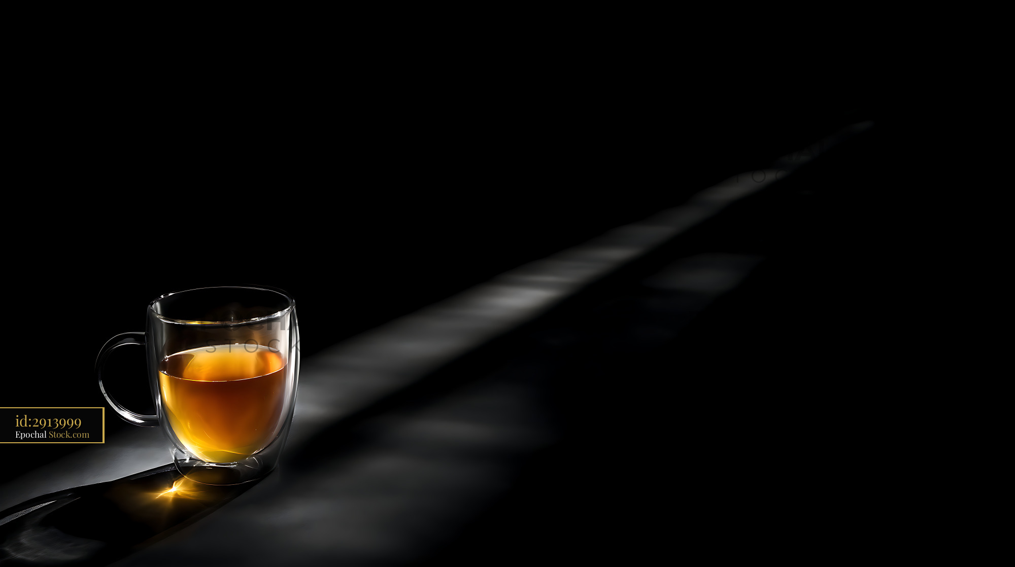 Tea Steaming in Glass Mug, Minimalist Black Setting - stock photo