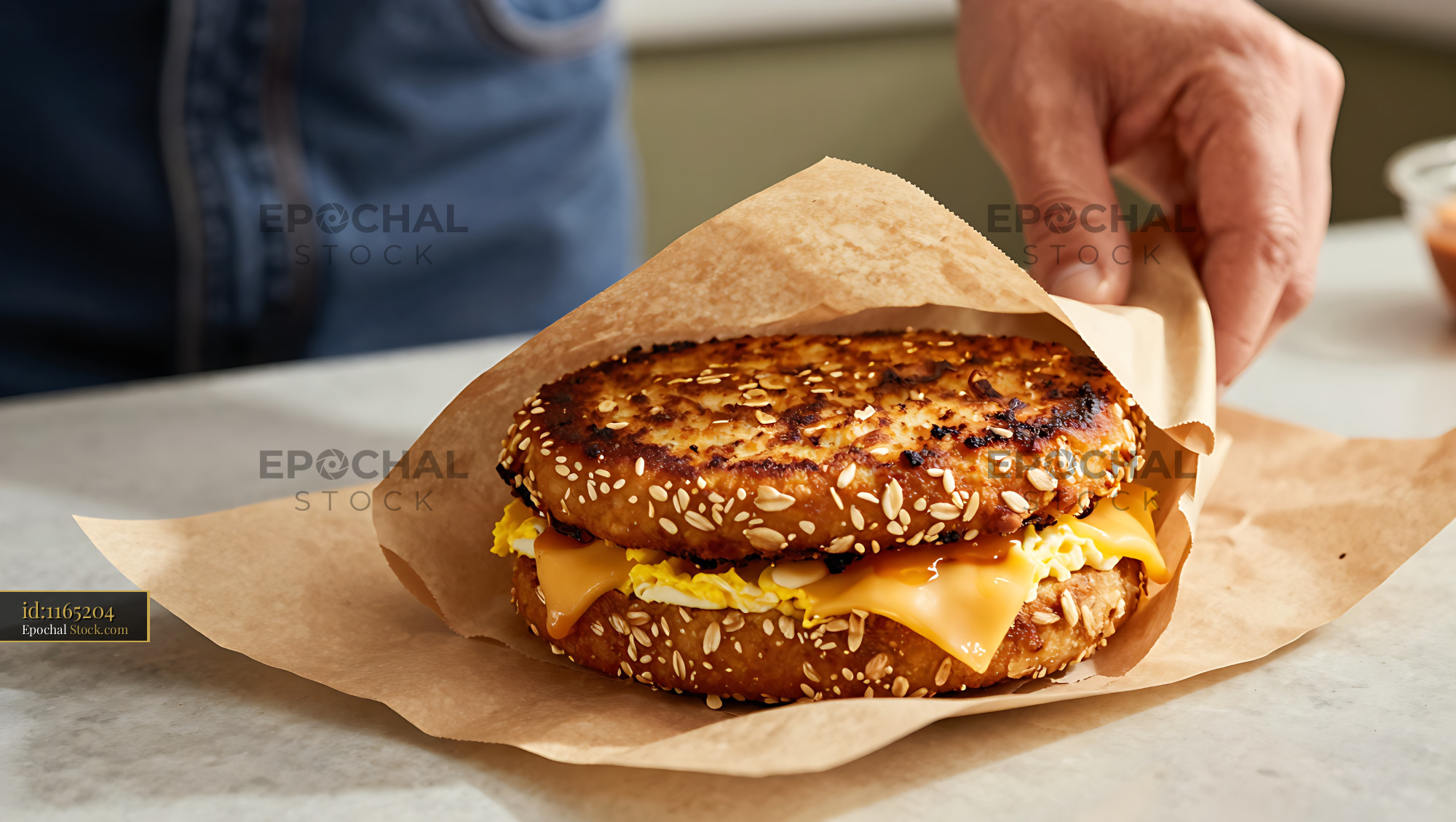 Goetta Breakfast Sandwich with Egg and Cheese on Seeded Bagel - stock photo