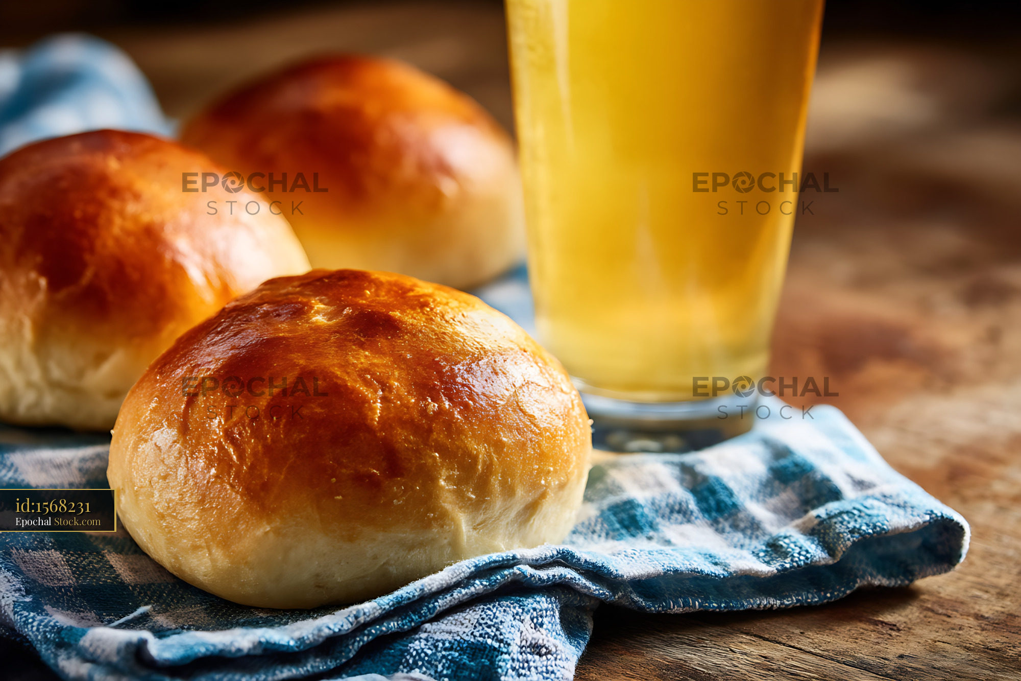 Bierocks With Apple Juice on Rustic Wooden Table With Checkered Cloth - stock photo