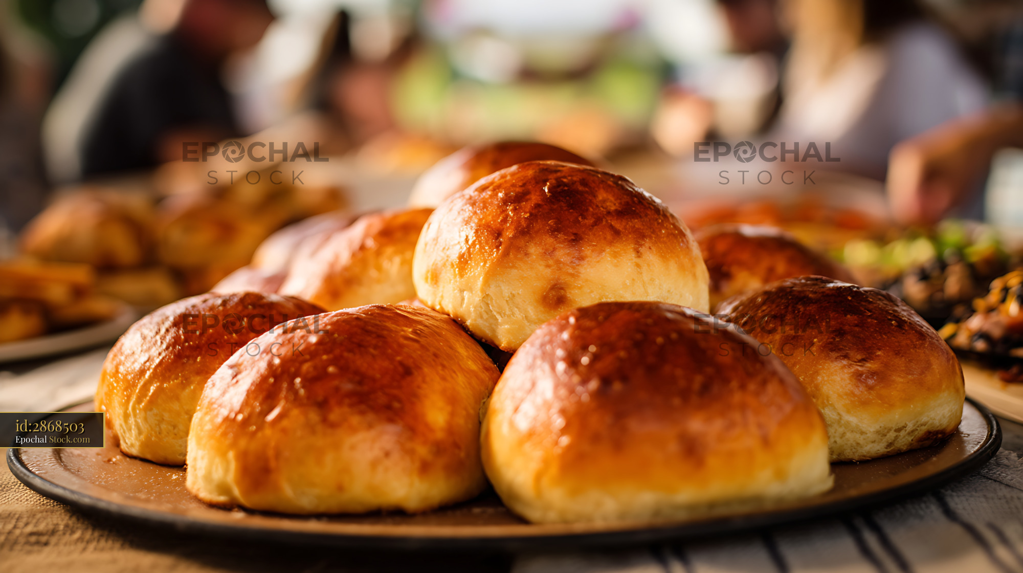 Bierocks on Rustic Plate, Golden Pastries at Family Dinner Table - stock photo