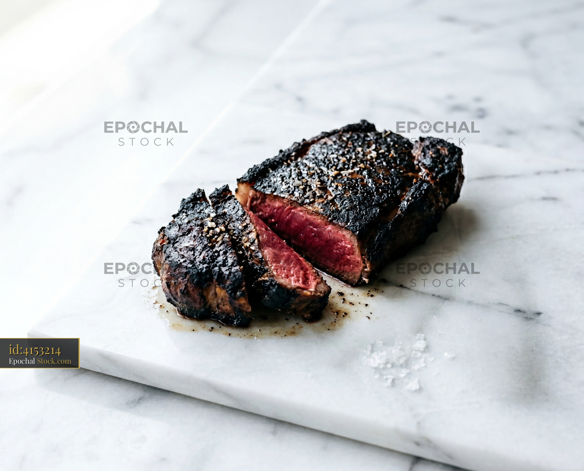 Prime Steak Sliced Medium-Rare on Marble - stock photo