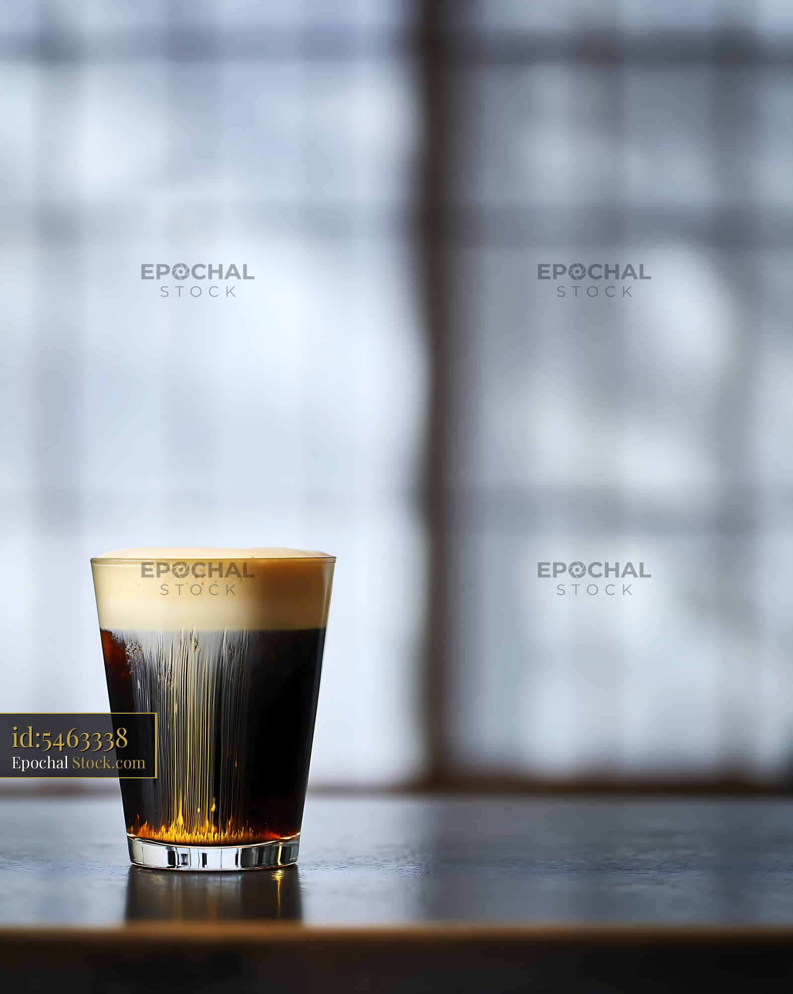 Nitro Caramel Coffee with Creamy Head in Window Light - stock photo