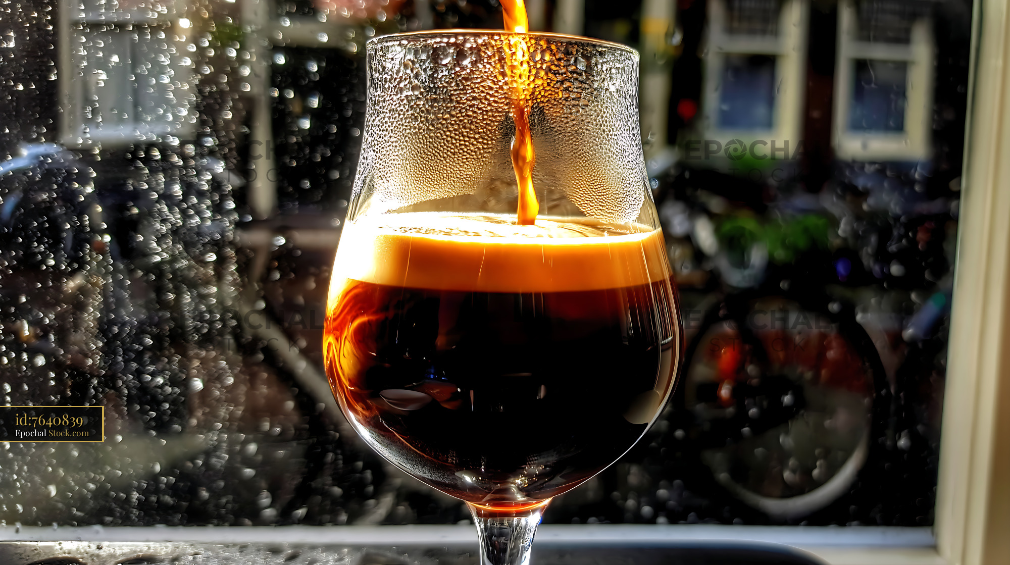 Nitro Caramel Coffee Poured Into Glass - stock photo