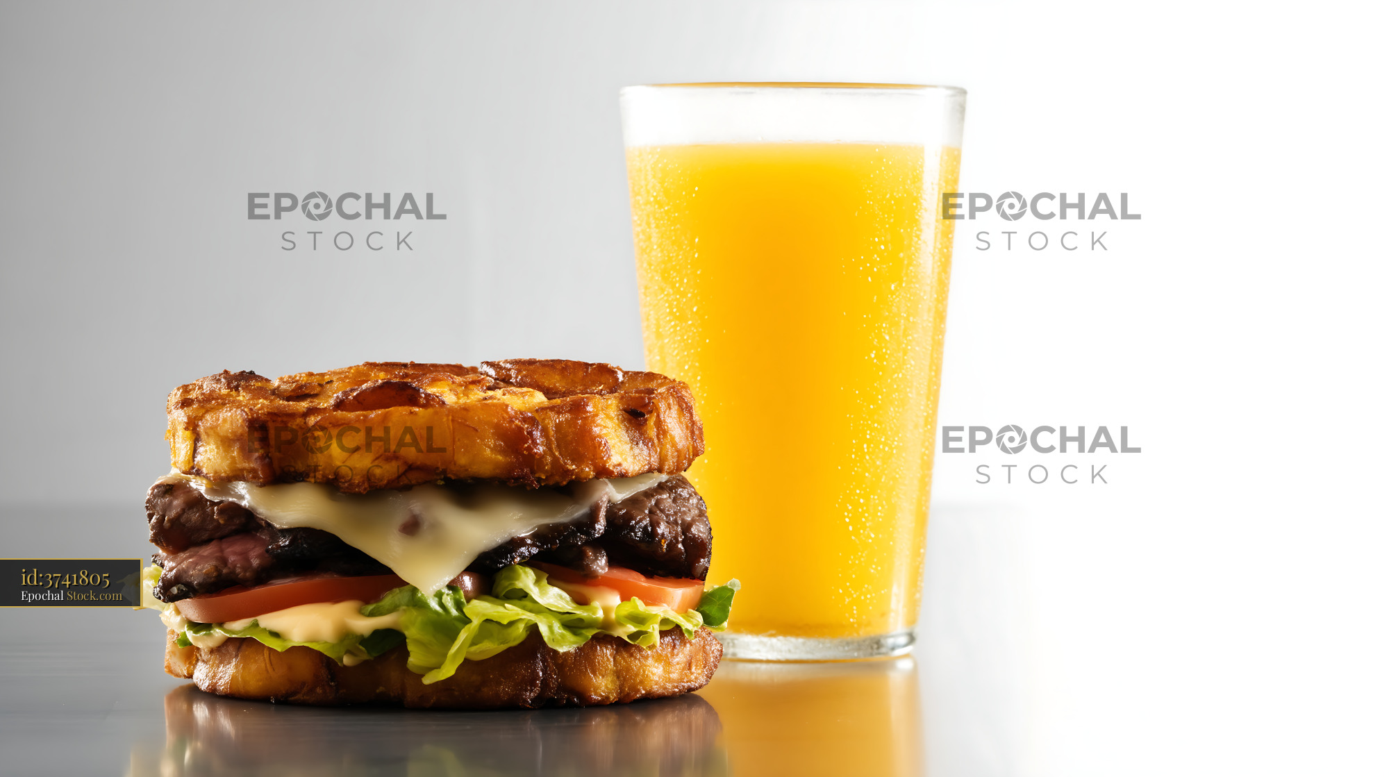 Gourmet Burger with Cheese and Orange Juice - stock photo