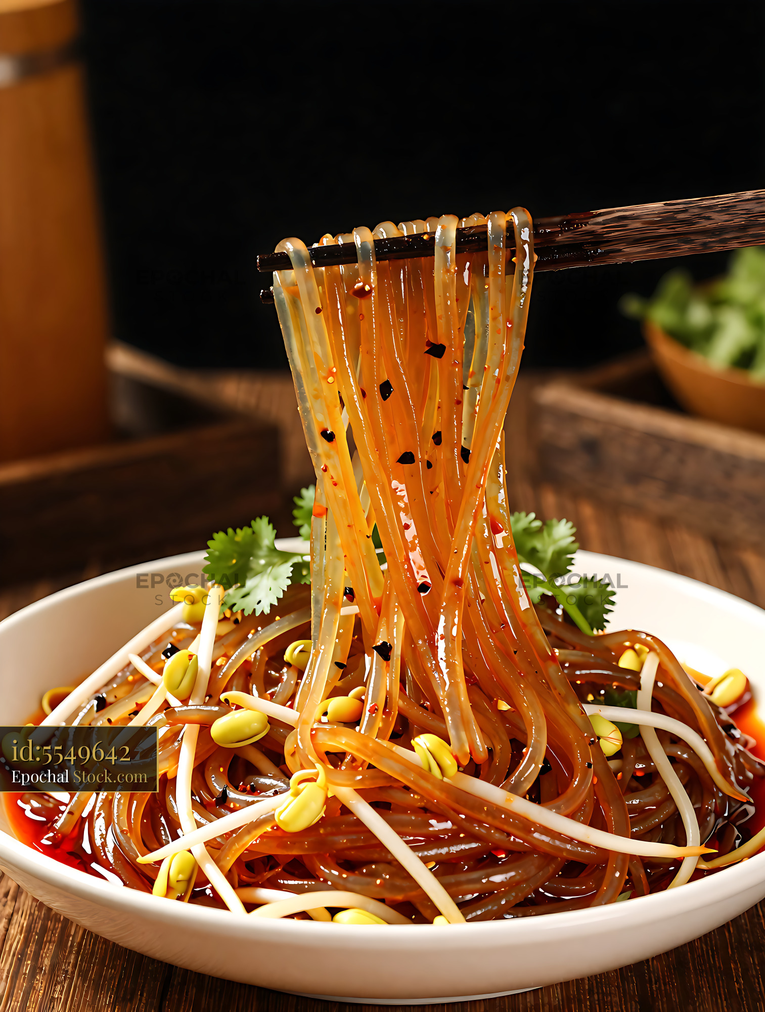Sichuan Glass Noodle Salad Lifted on Chopsticks - stock photo